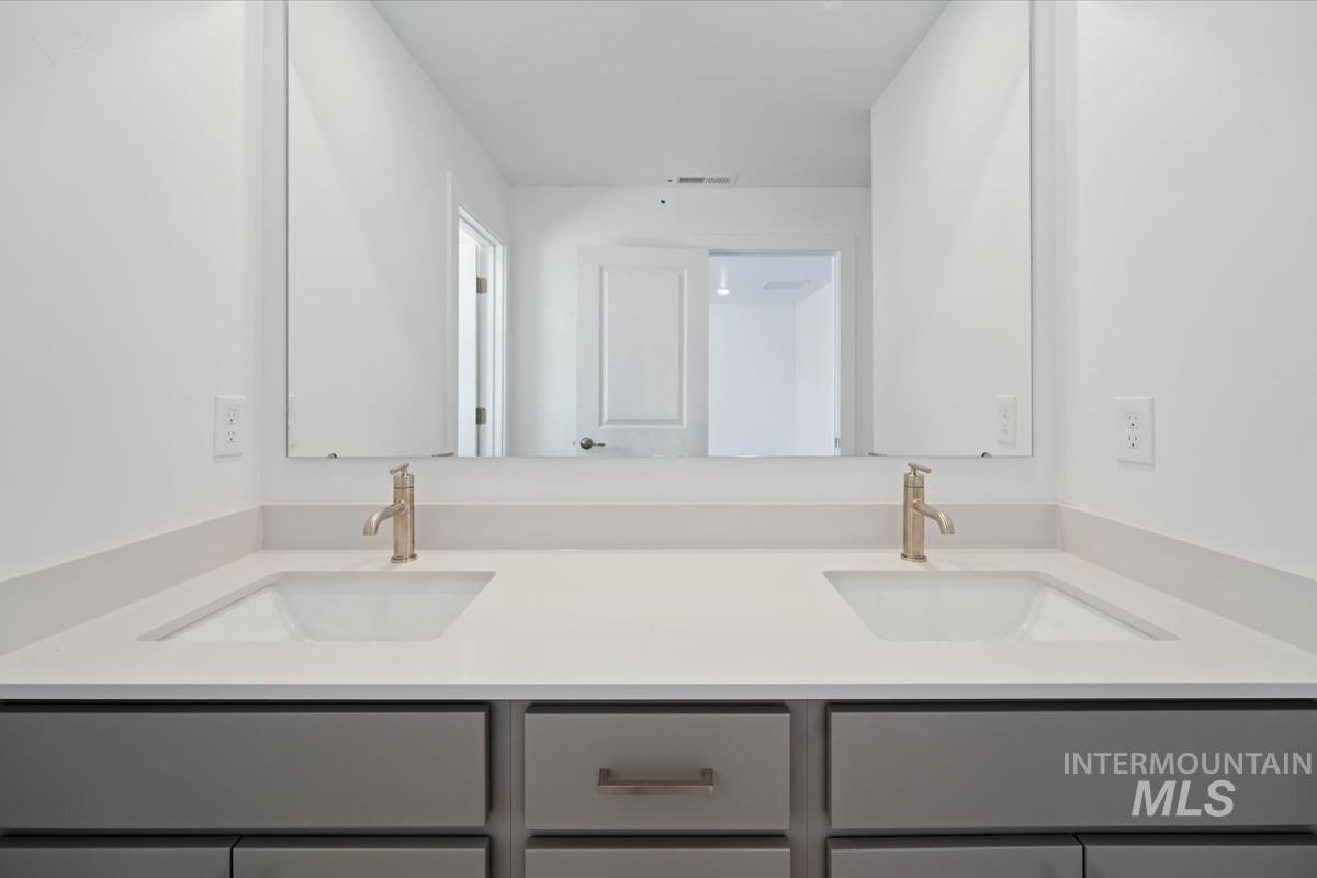 Bathroom featuring double vanity