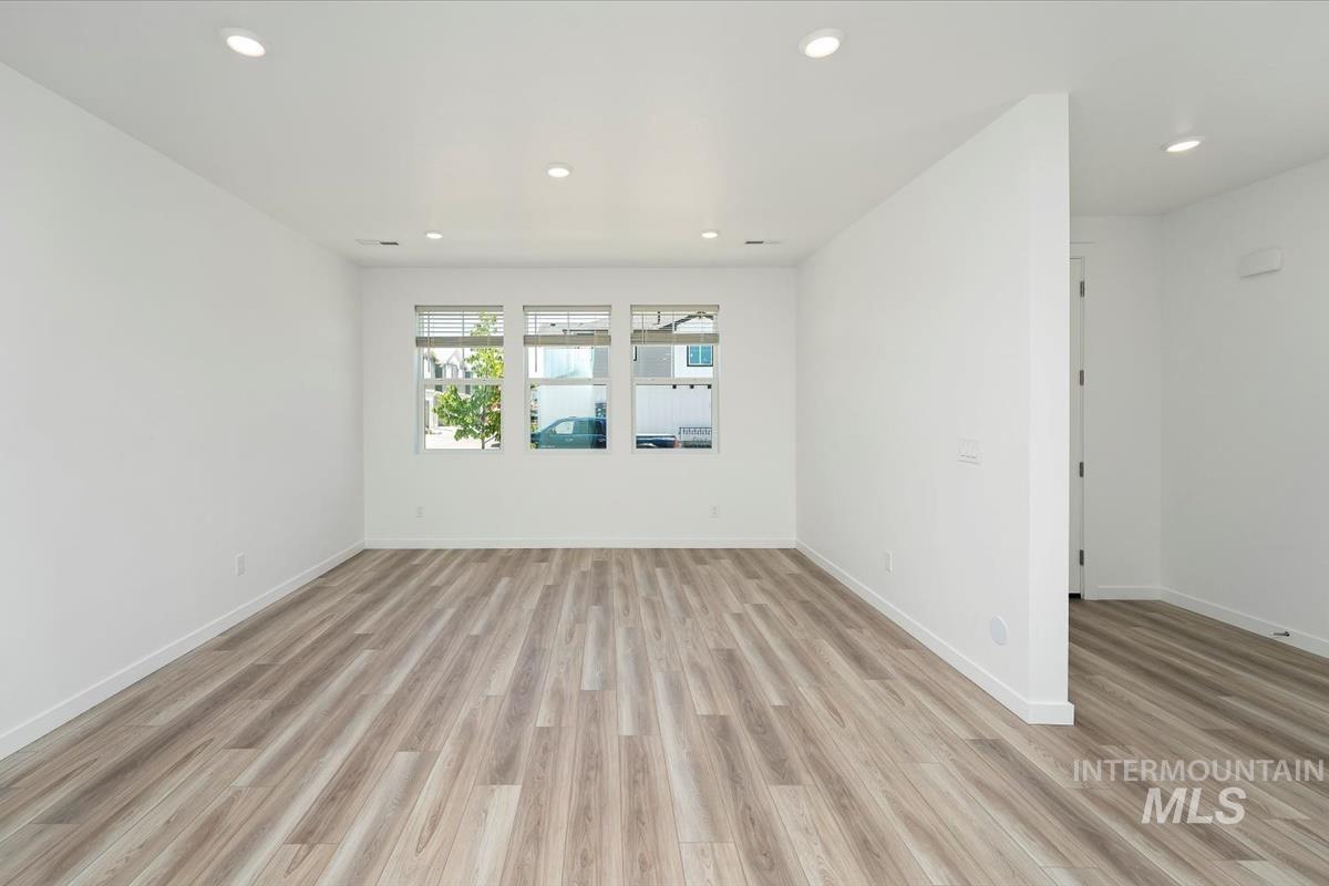 Unfurnished room featuring light wood-type flooring and recessed lighting