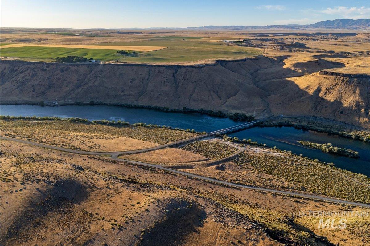Overview of rural landscape featuring a water and mountain view