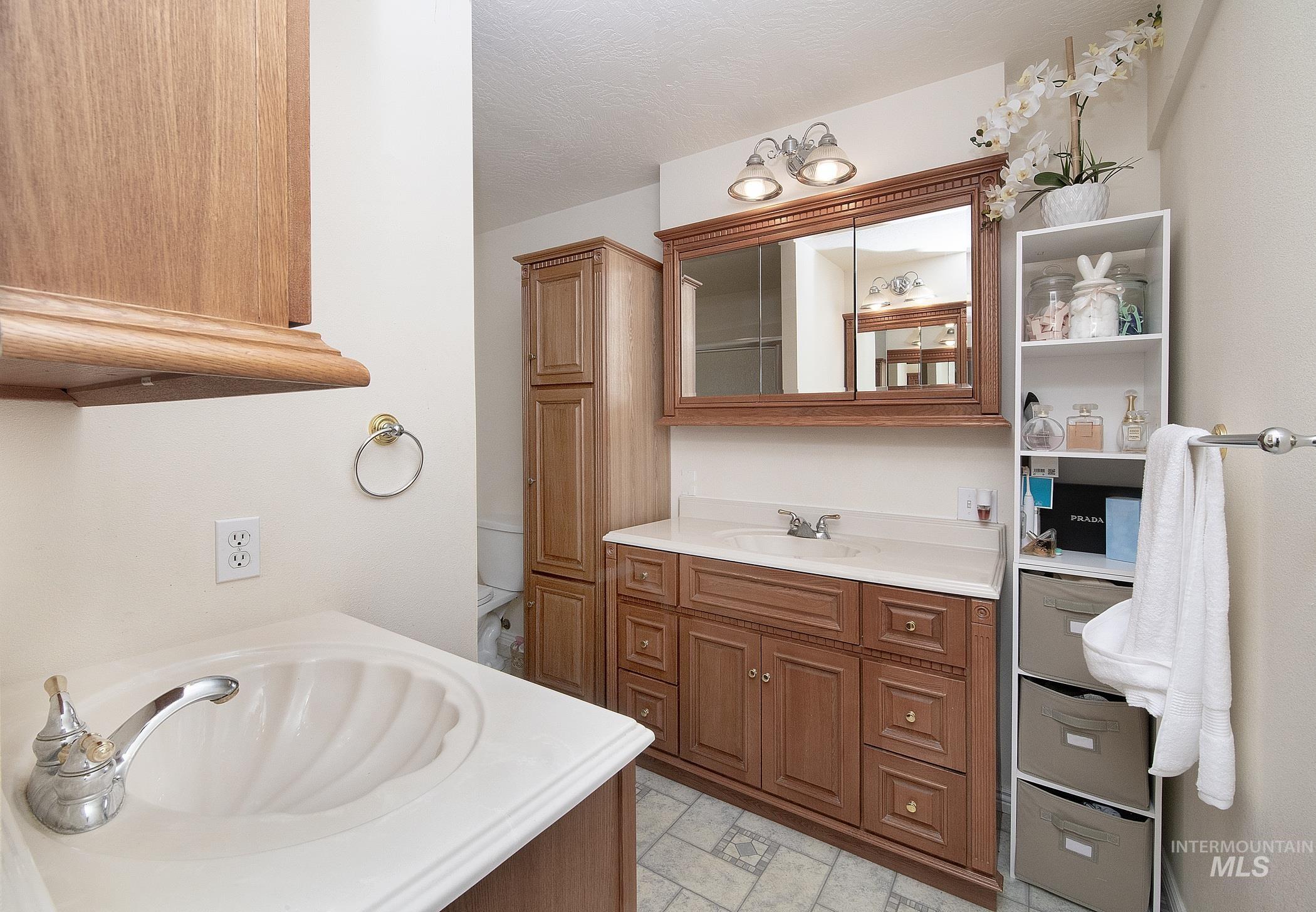 Bathroom featuring vanity and toilet