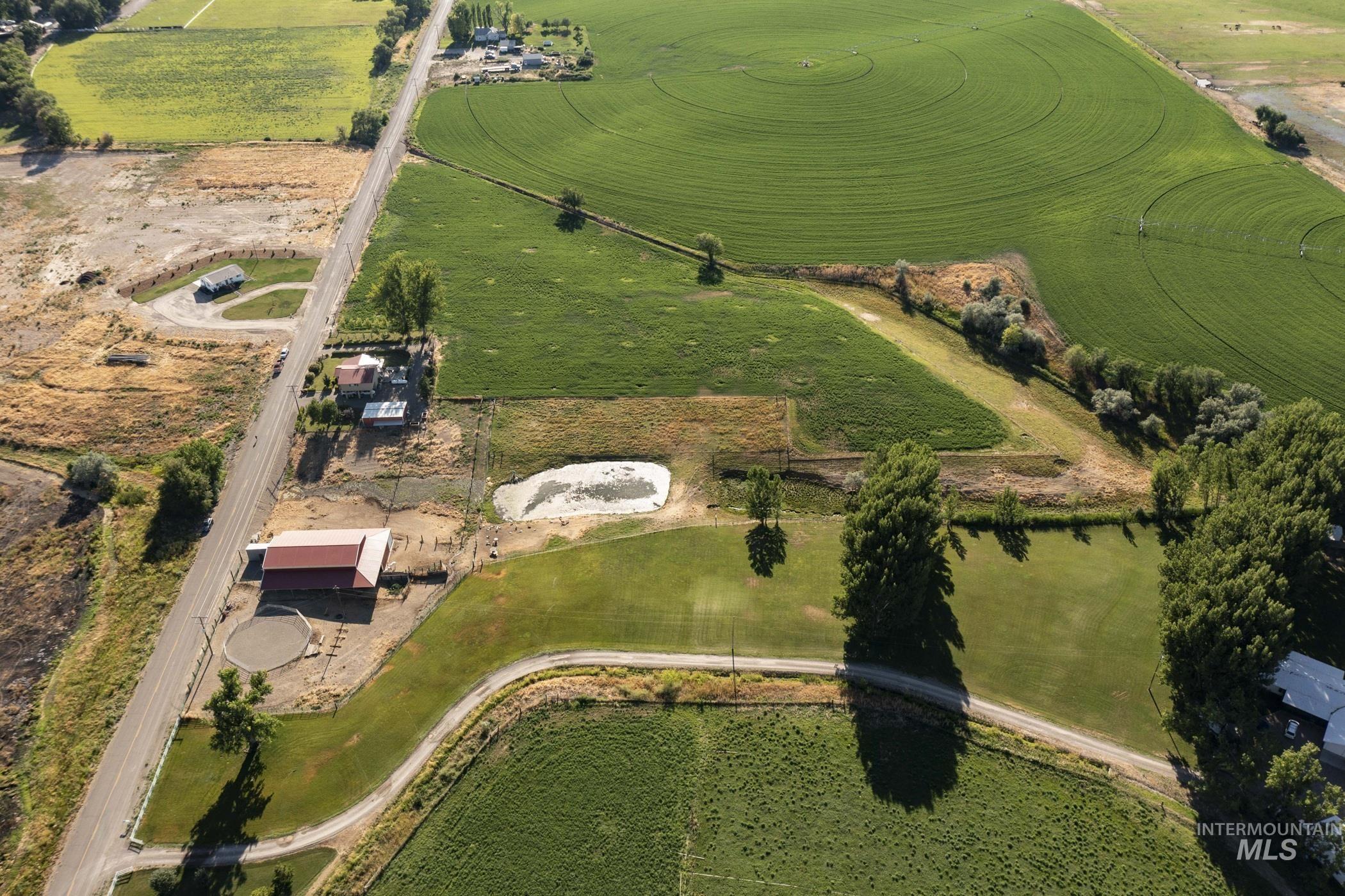 Aerial view of property and surrounding area with rural landscape