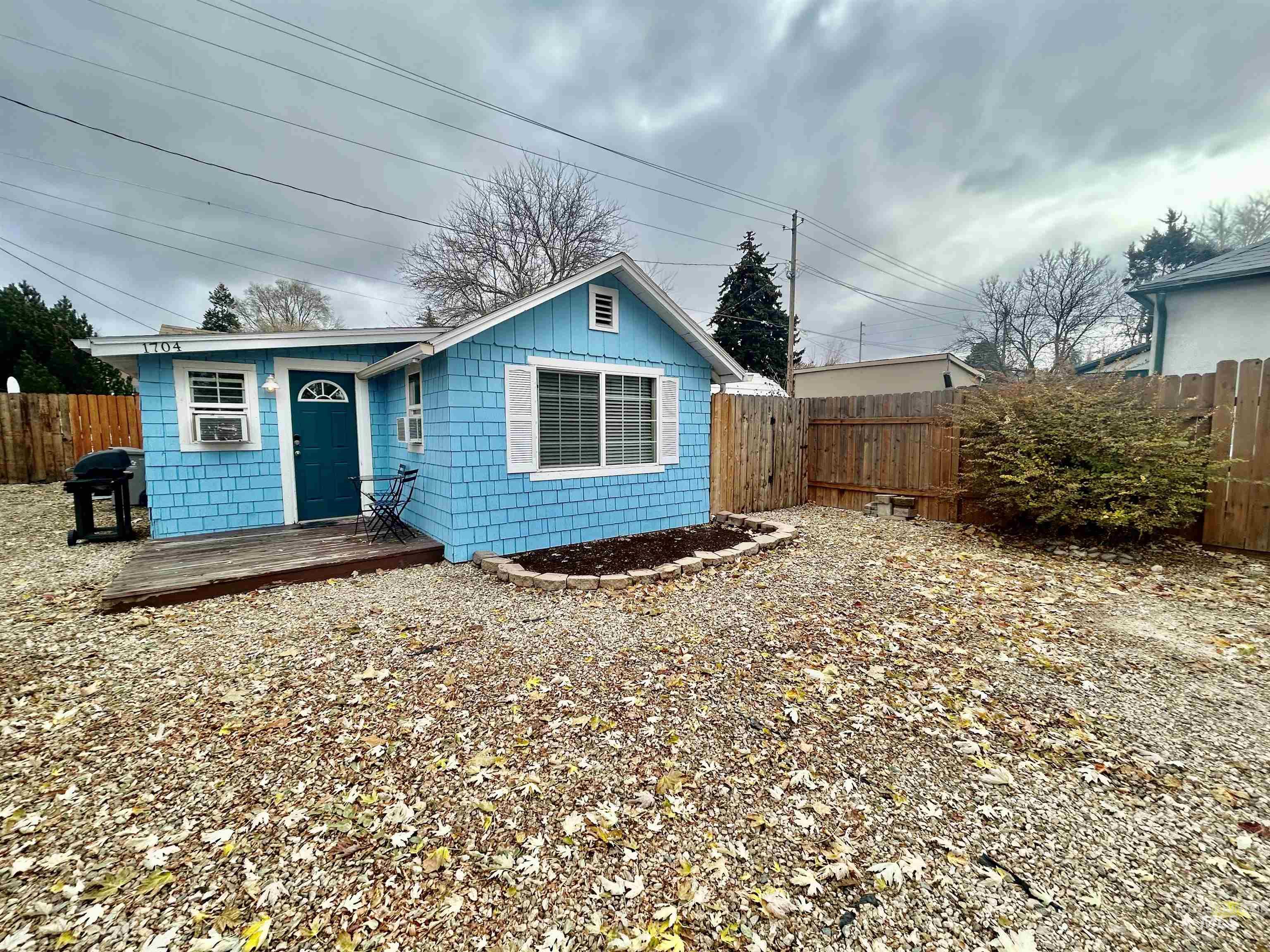 View of front of house with a fenced backyard