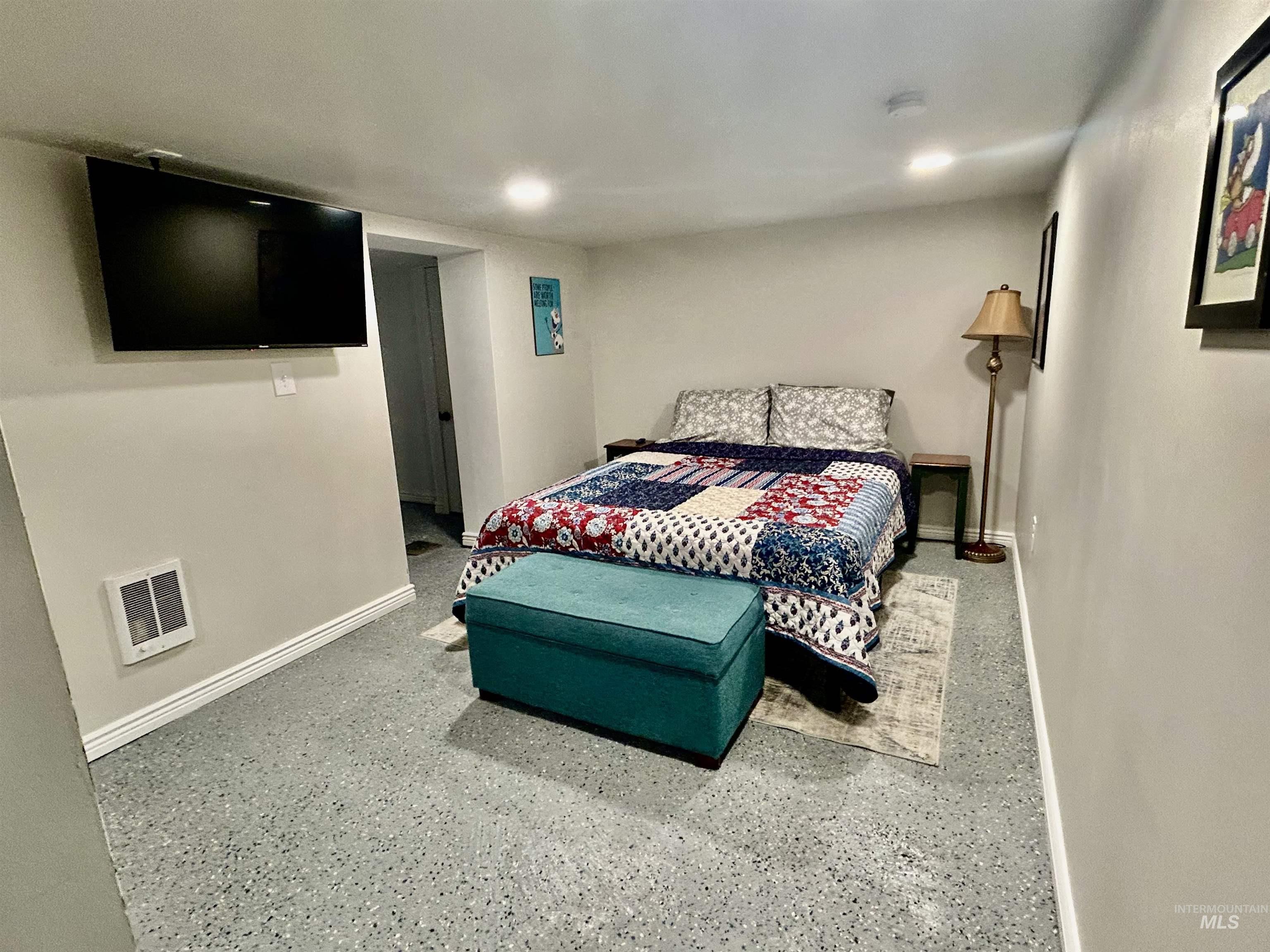 Bedroom featuring baseboards