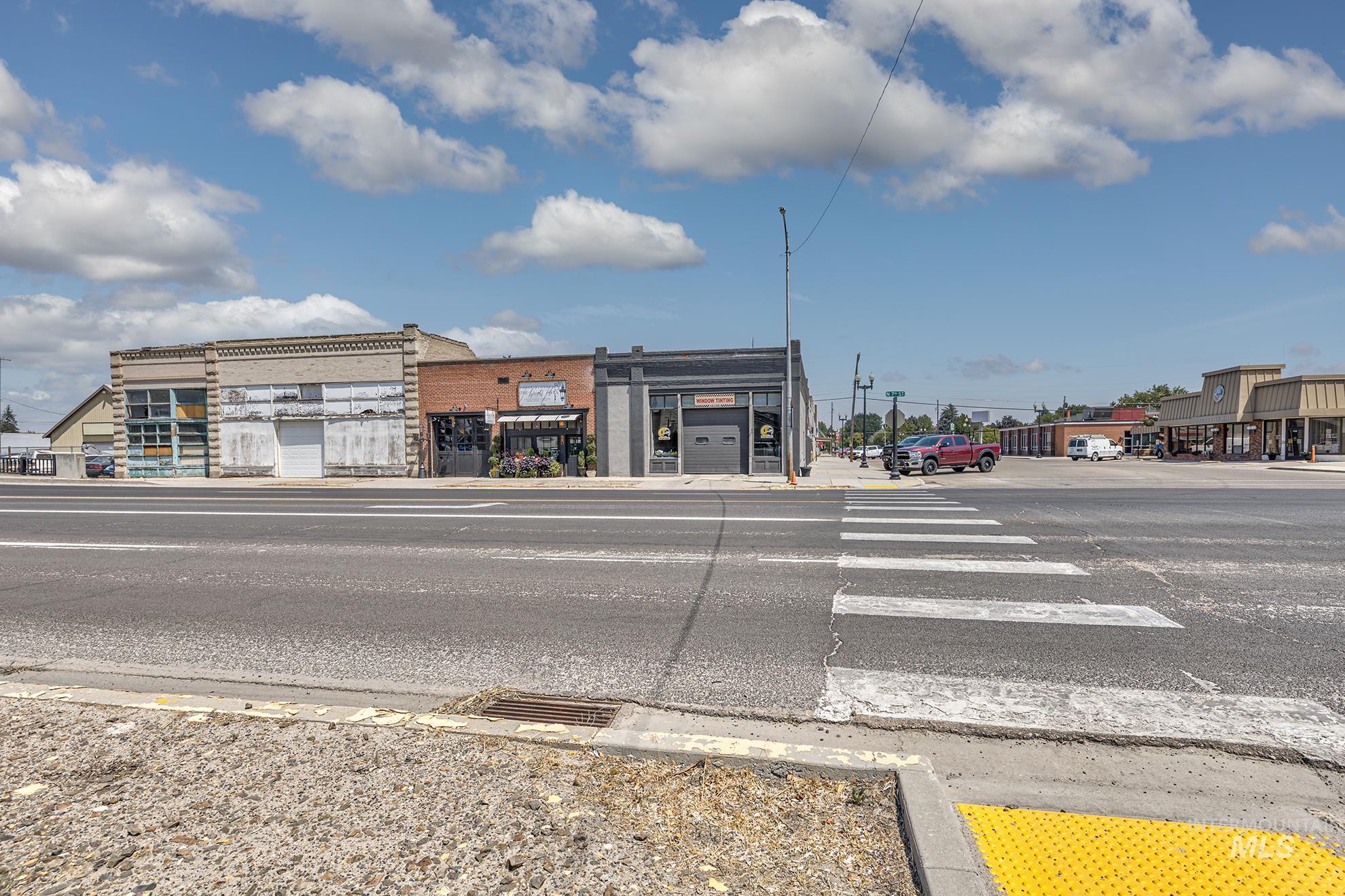 View of asphalt street with sidewalks