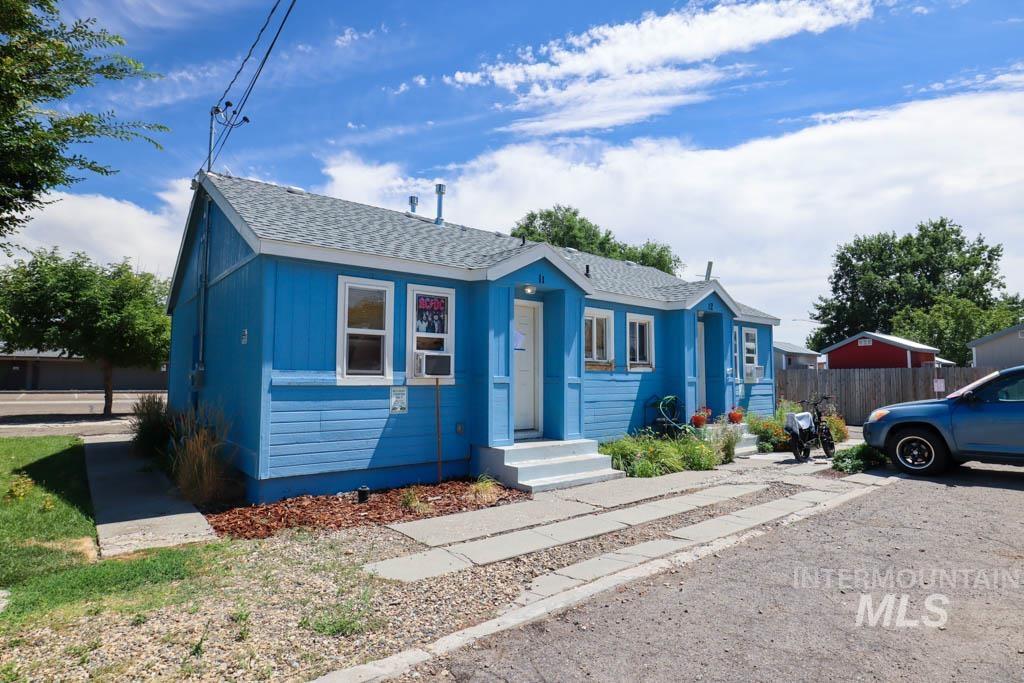 Bungalow-style house featuring a shingled roof
