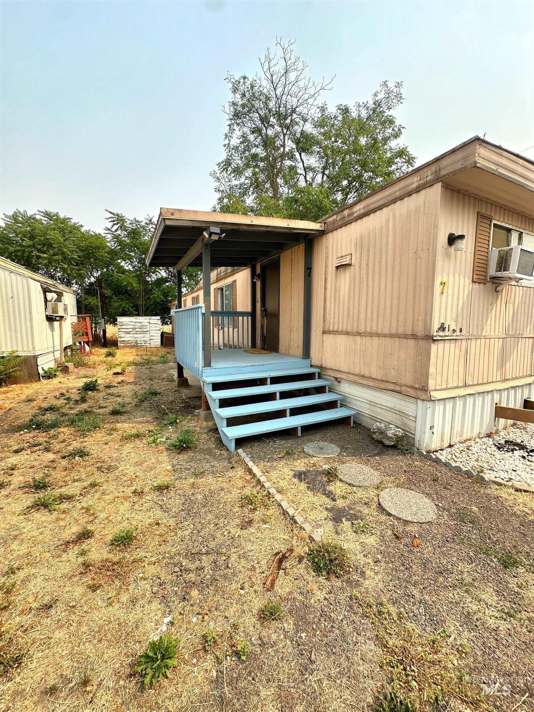 View of side of property with a deck