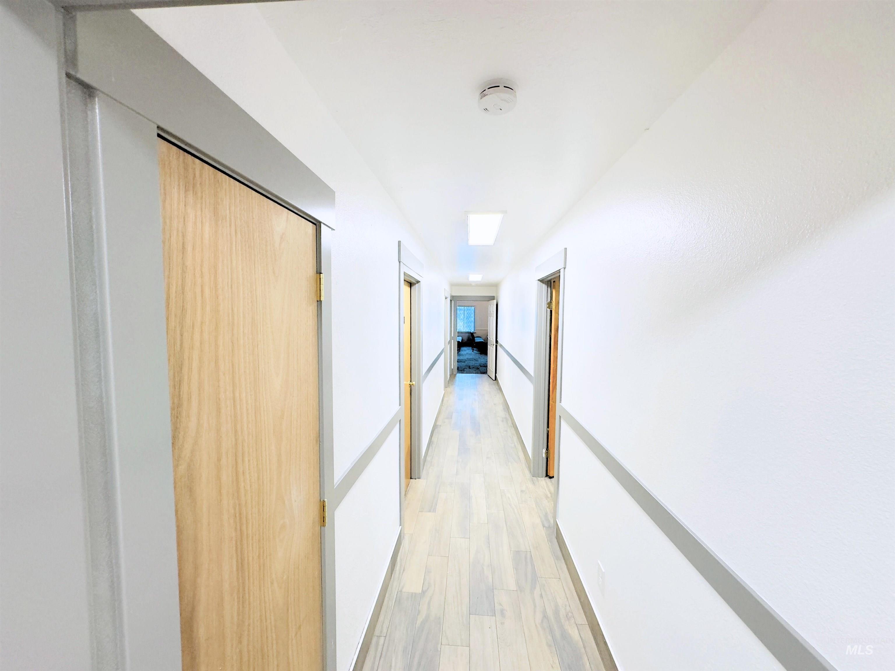 Hall with light wood-type flooring