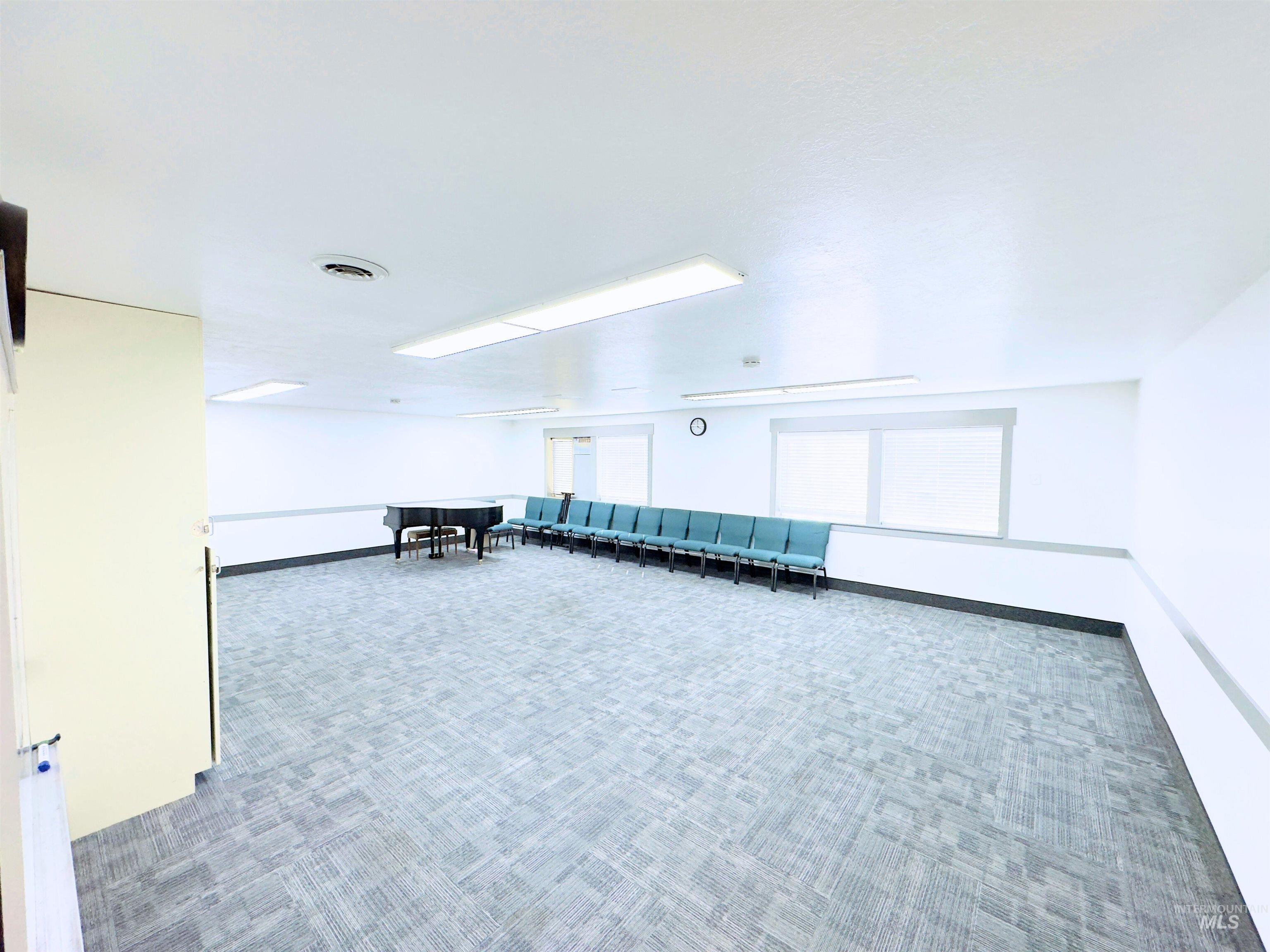 Spare room with carpet flooring and baseboards