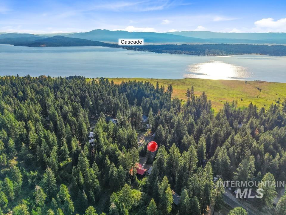 Aerial view of a water and mountain view and a heavily wooded area
