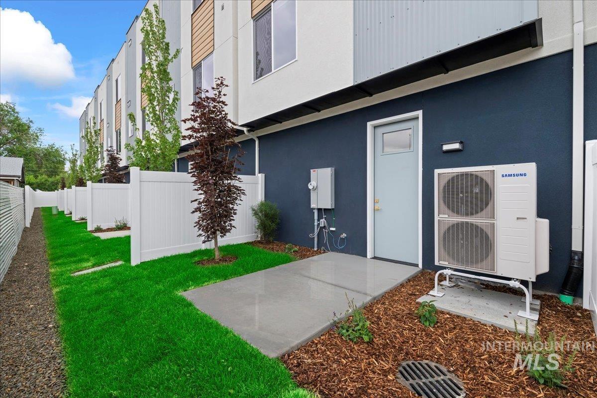 Entrance to property with stucco siding