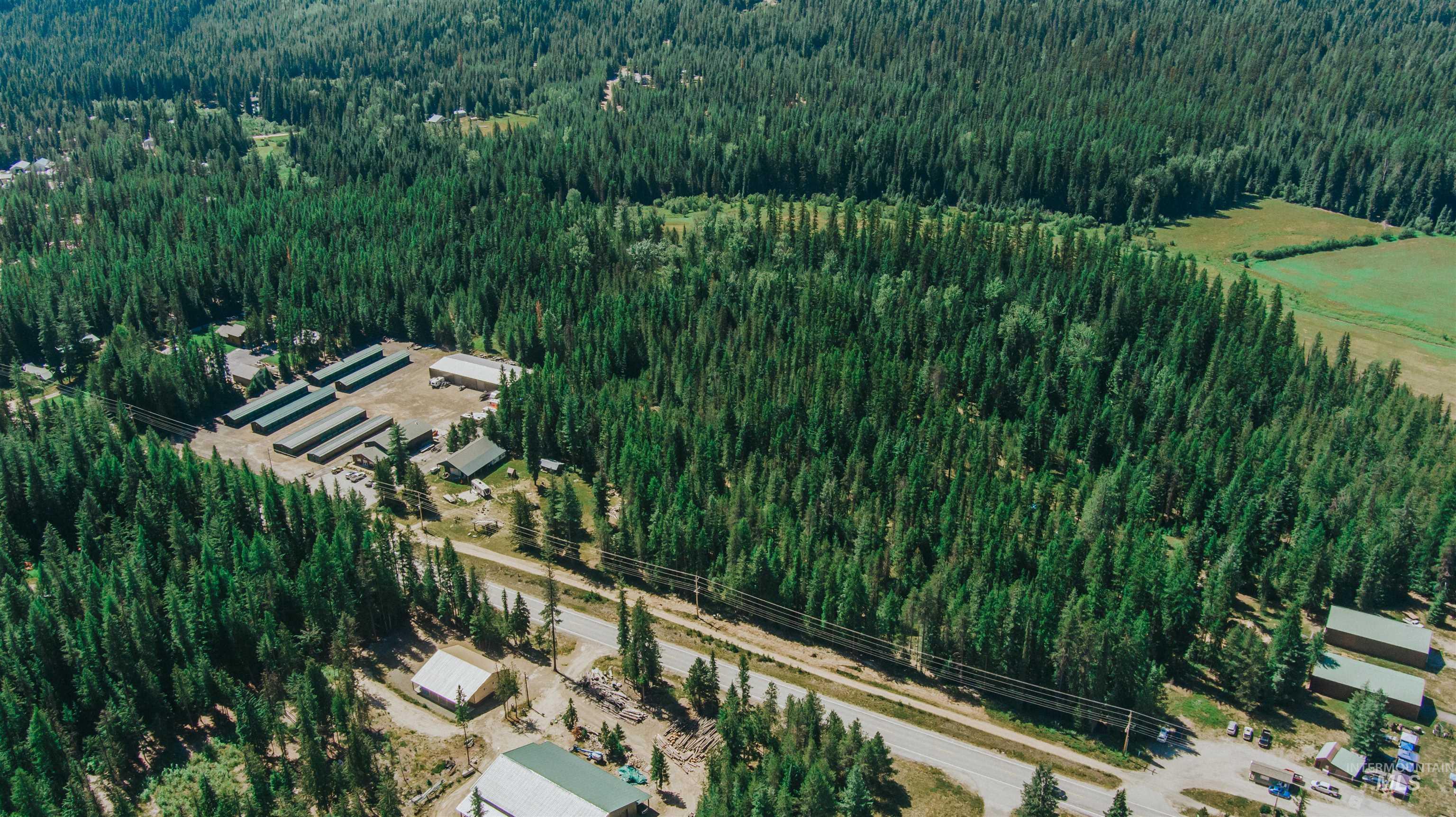 Aerial overview of property's location featuring a heavily wooded area