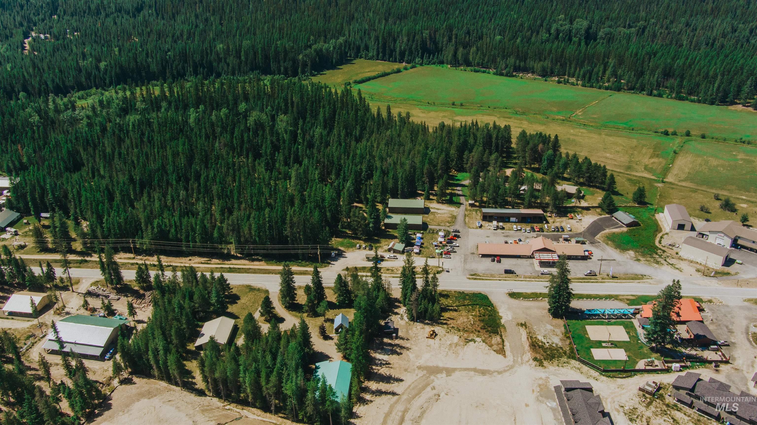 Aerial view of property's location with a forest