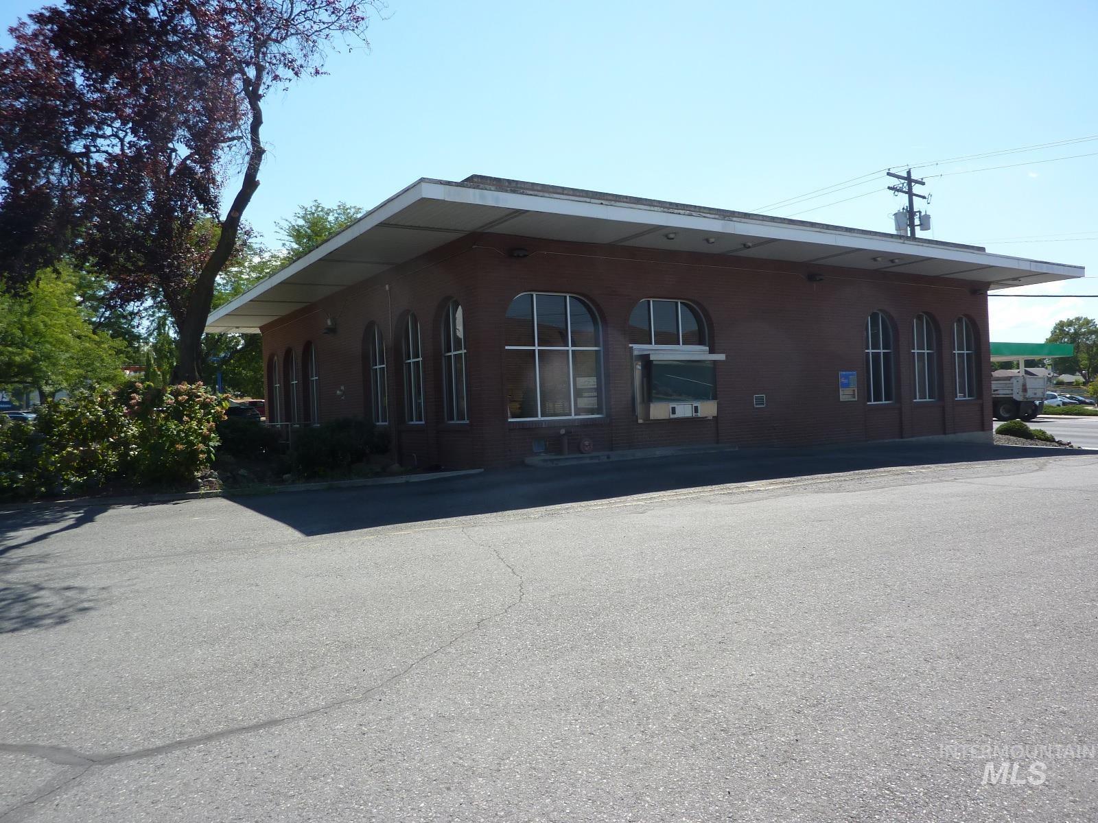 View of property exterior with brick siding