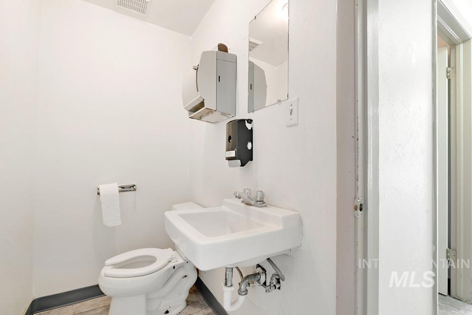 Bathroom featuring toilet and a sink