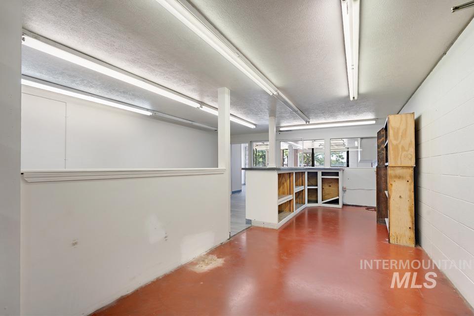 Below grade area with a textured ceiling