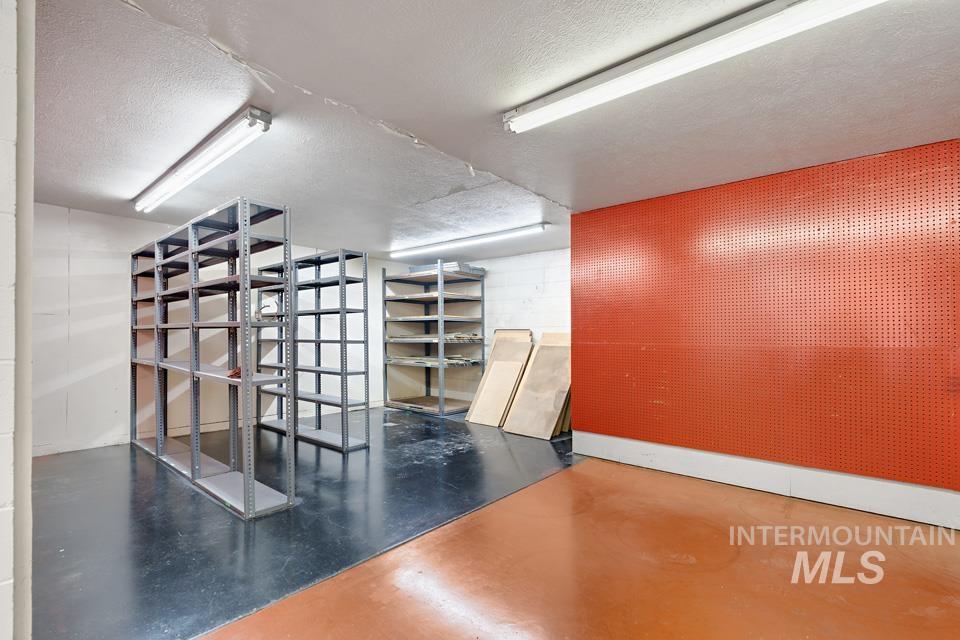Finished basement with a textured ceiling