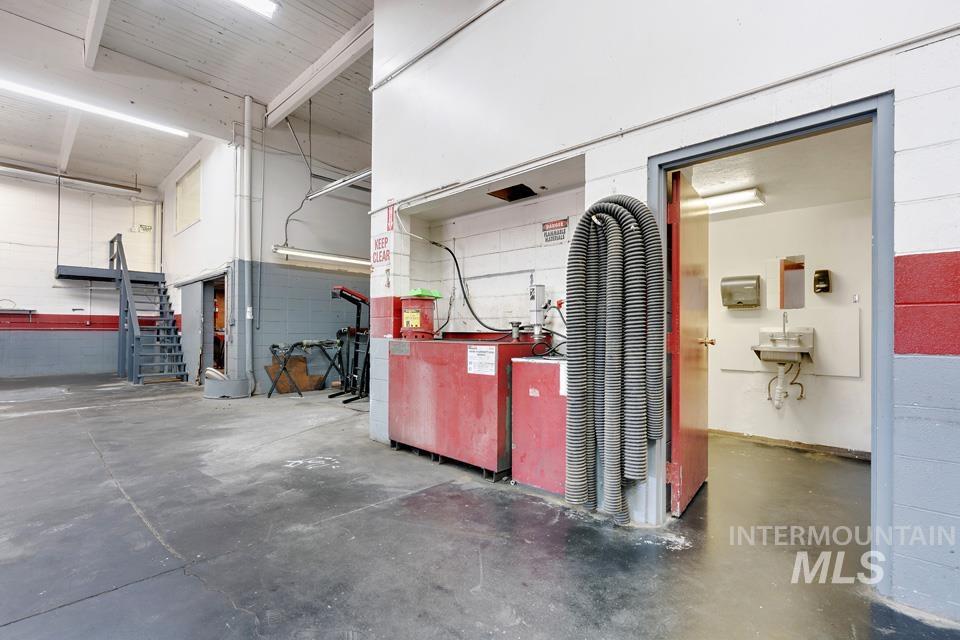 Garage featuring a workshop area and a sink