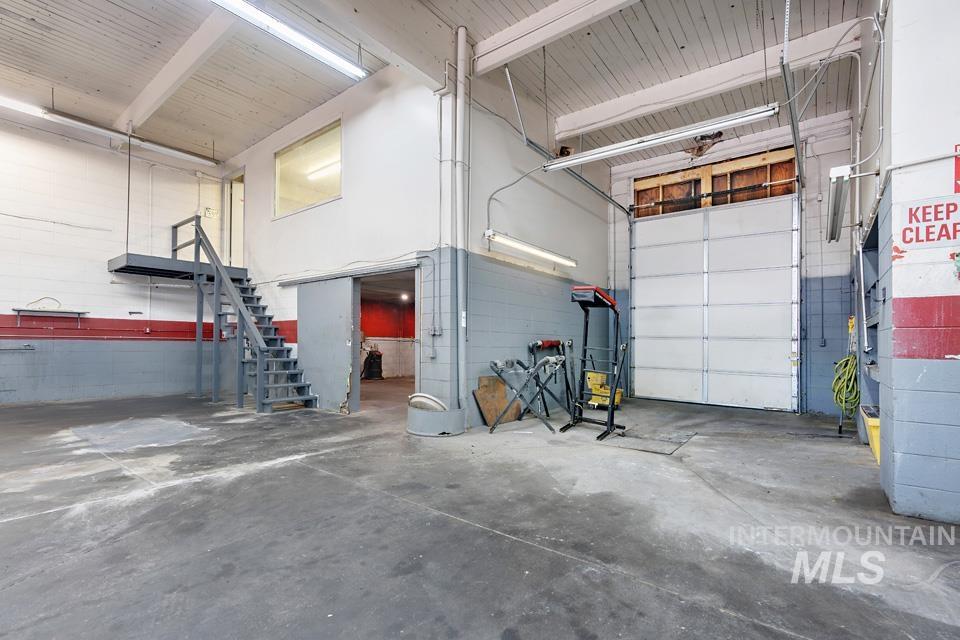 Garage featuring concrete block wall
