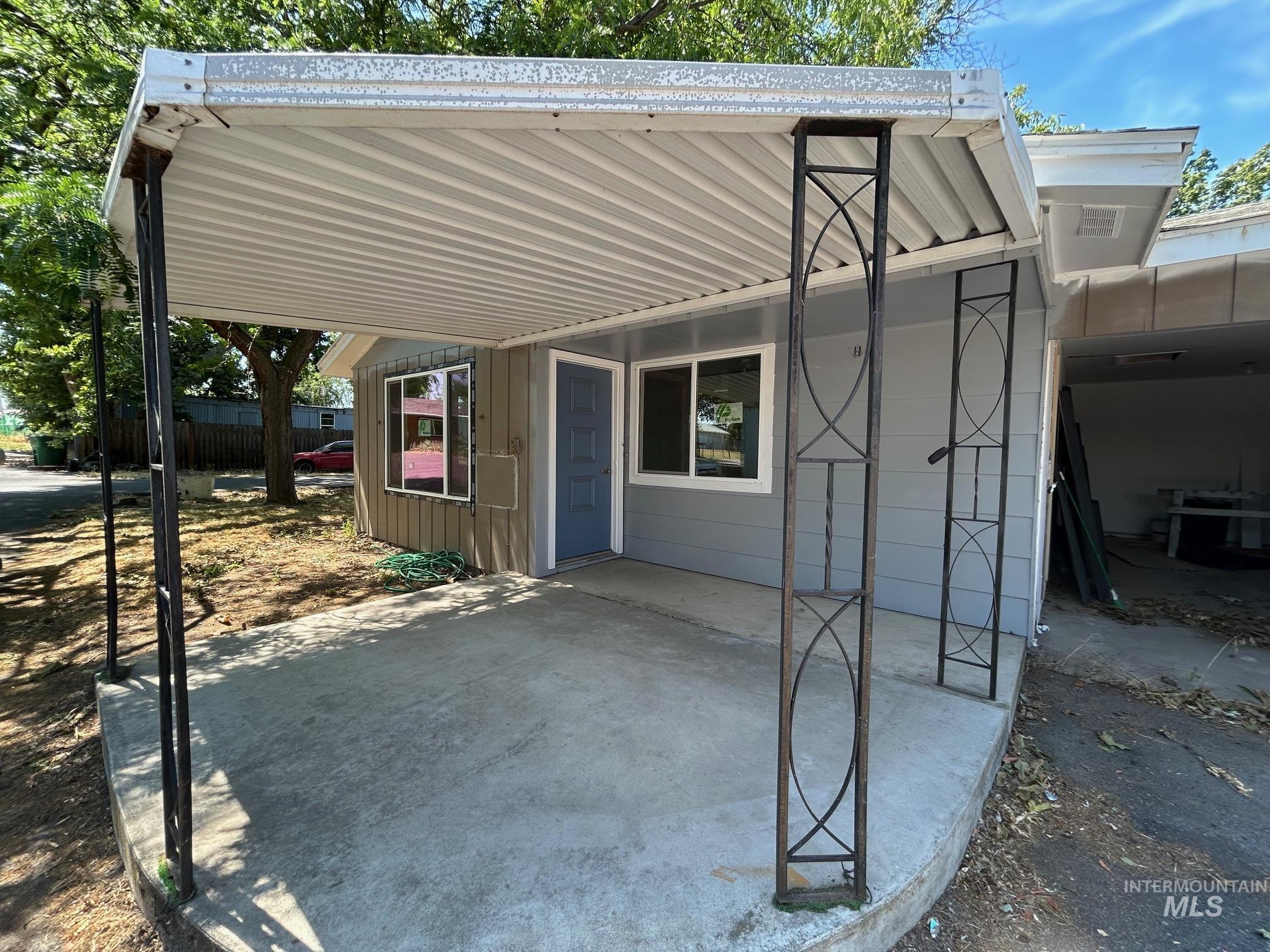 View of patio with an attached carport