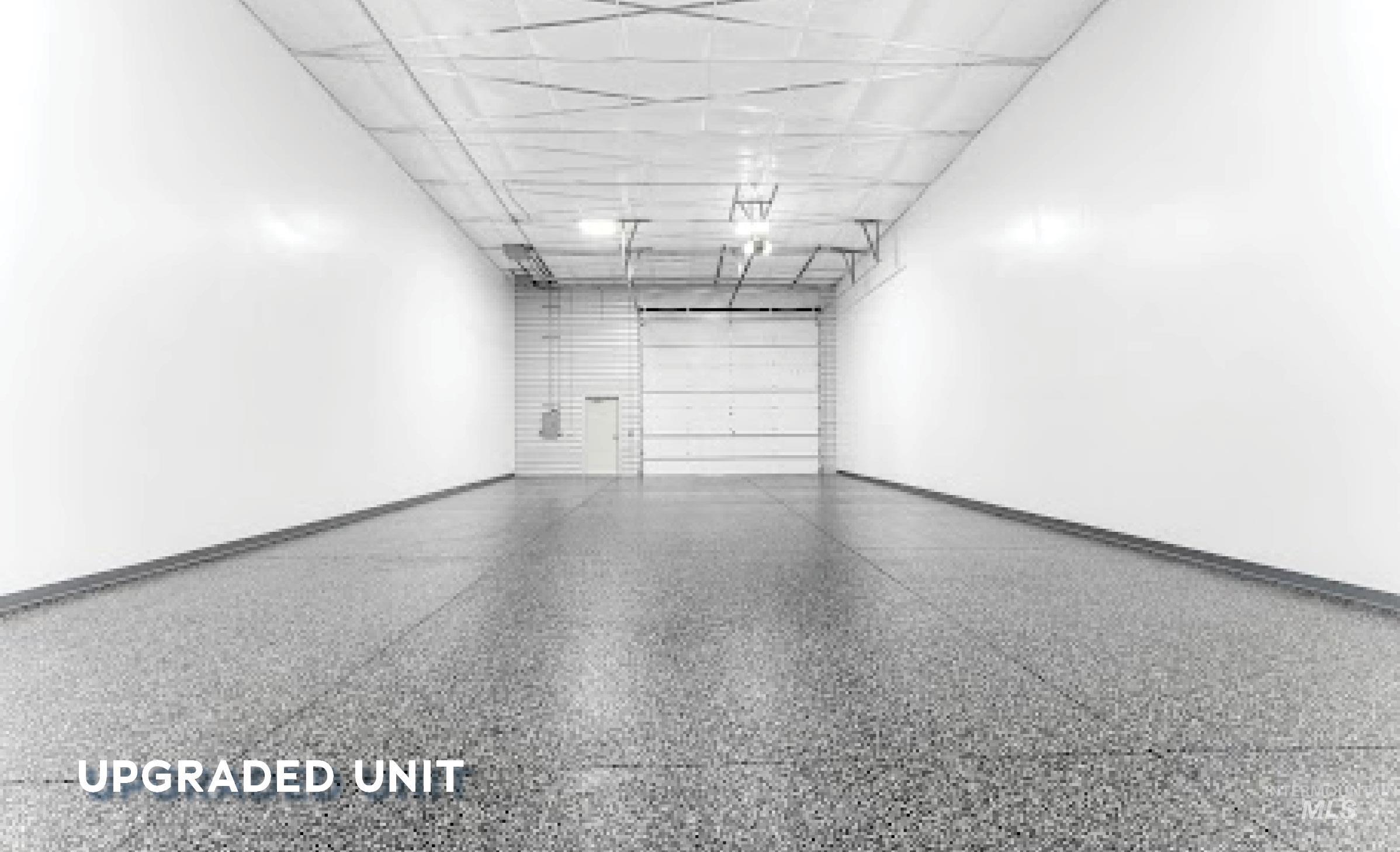 Garage featuring baseboards