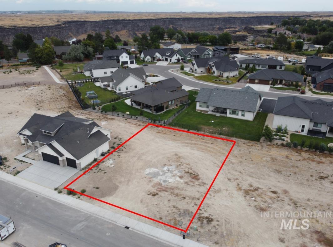 Aerial perspective of suburban area with property boundaries highlighted