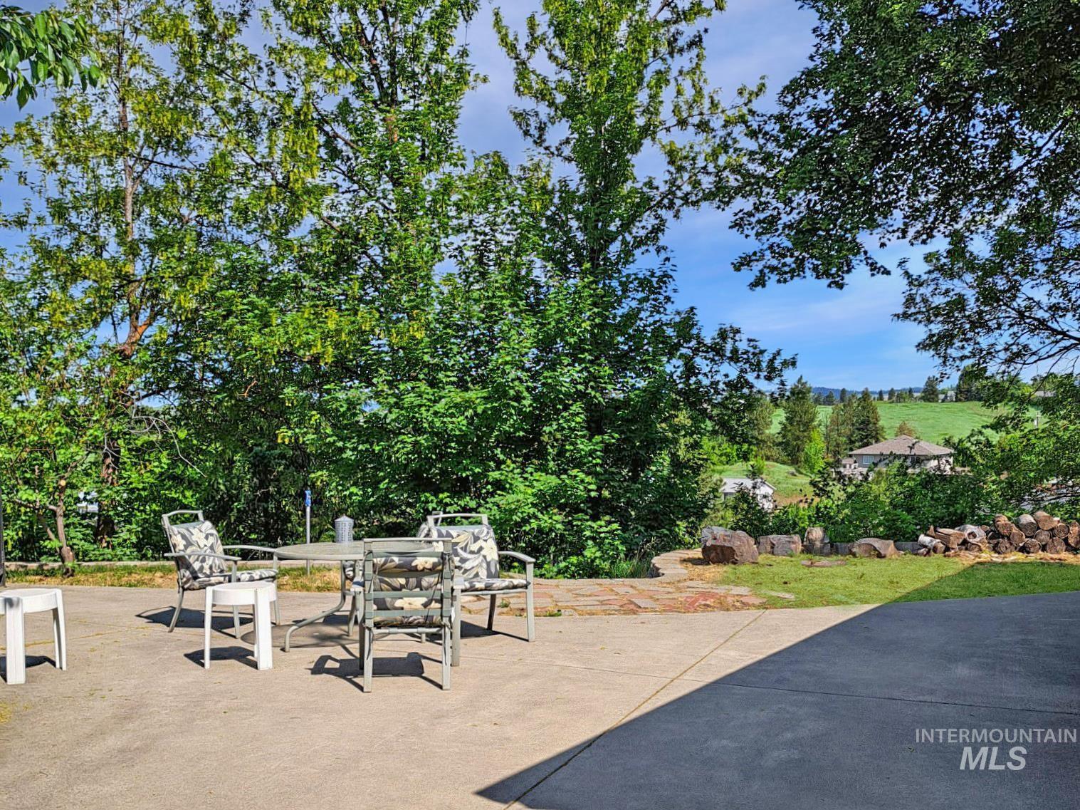 View of patio with outdoor dining area