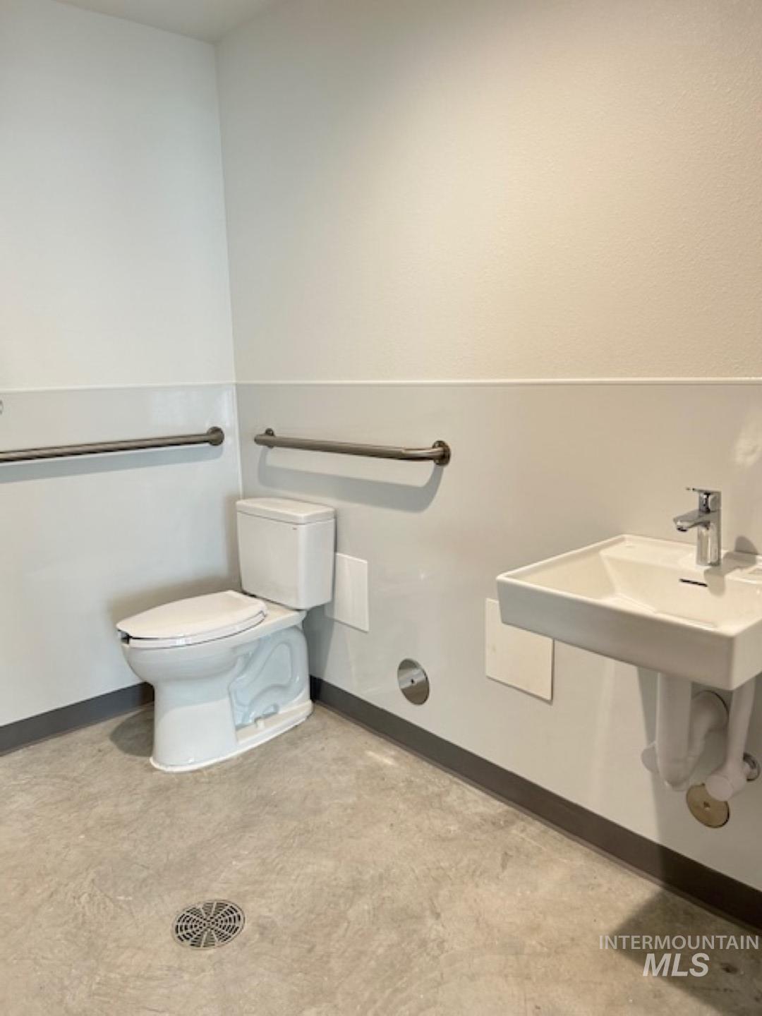 Bathroom featuring baseboards