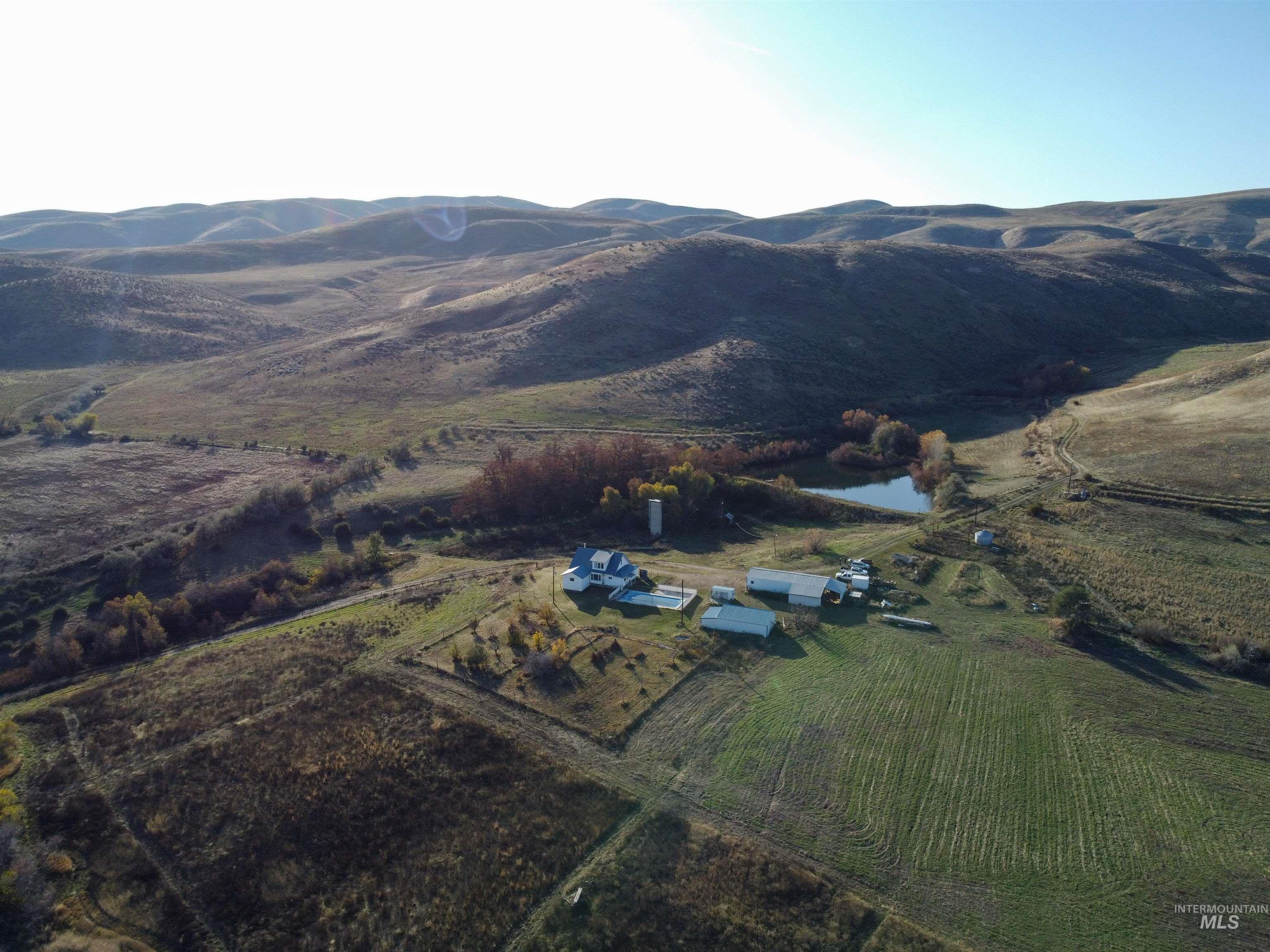 View of property location featuring rural landscape and a water and mountain view