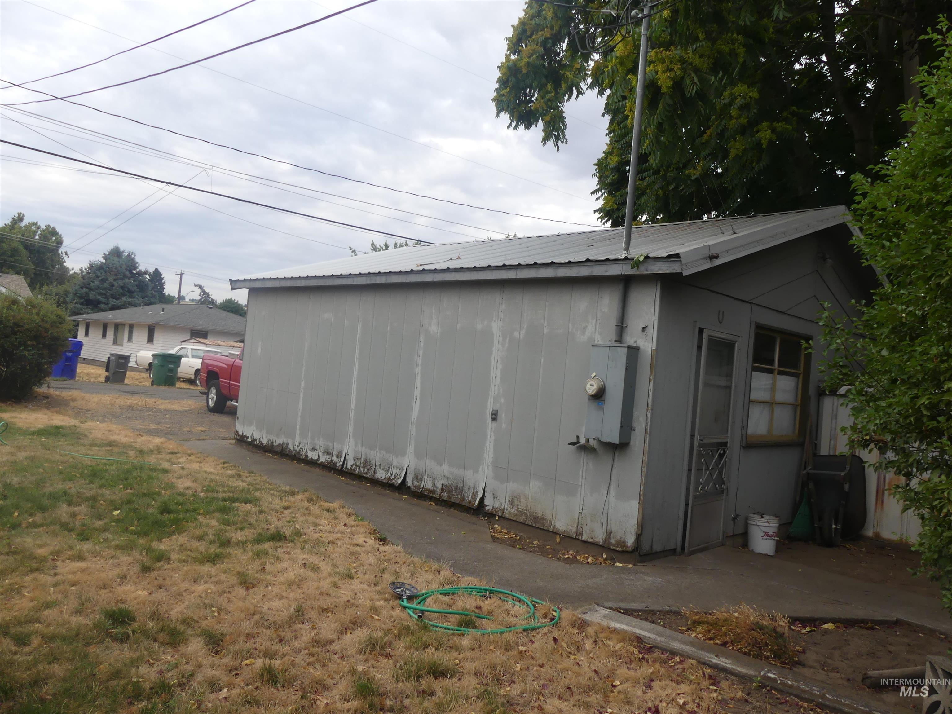 View of side of home featuring a metal roof