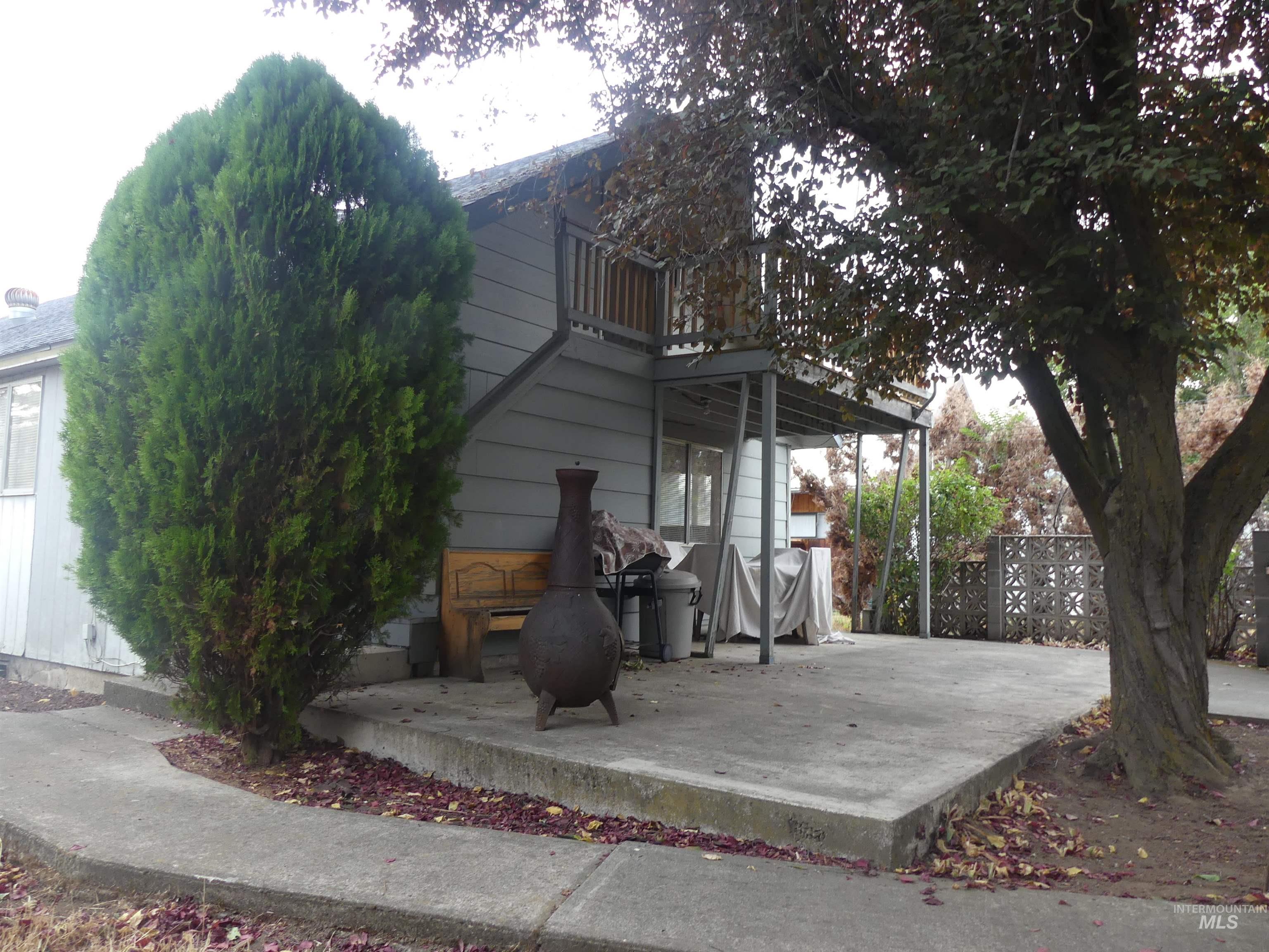 View of side of home featuring a patio