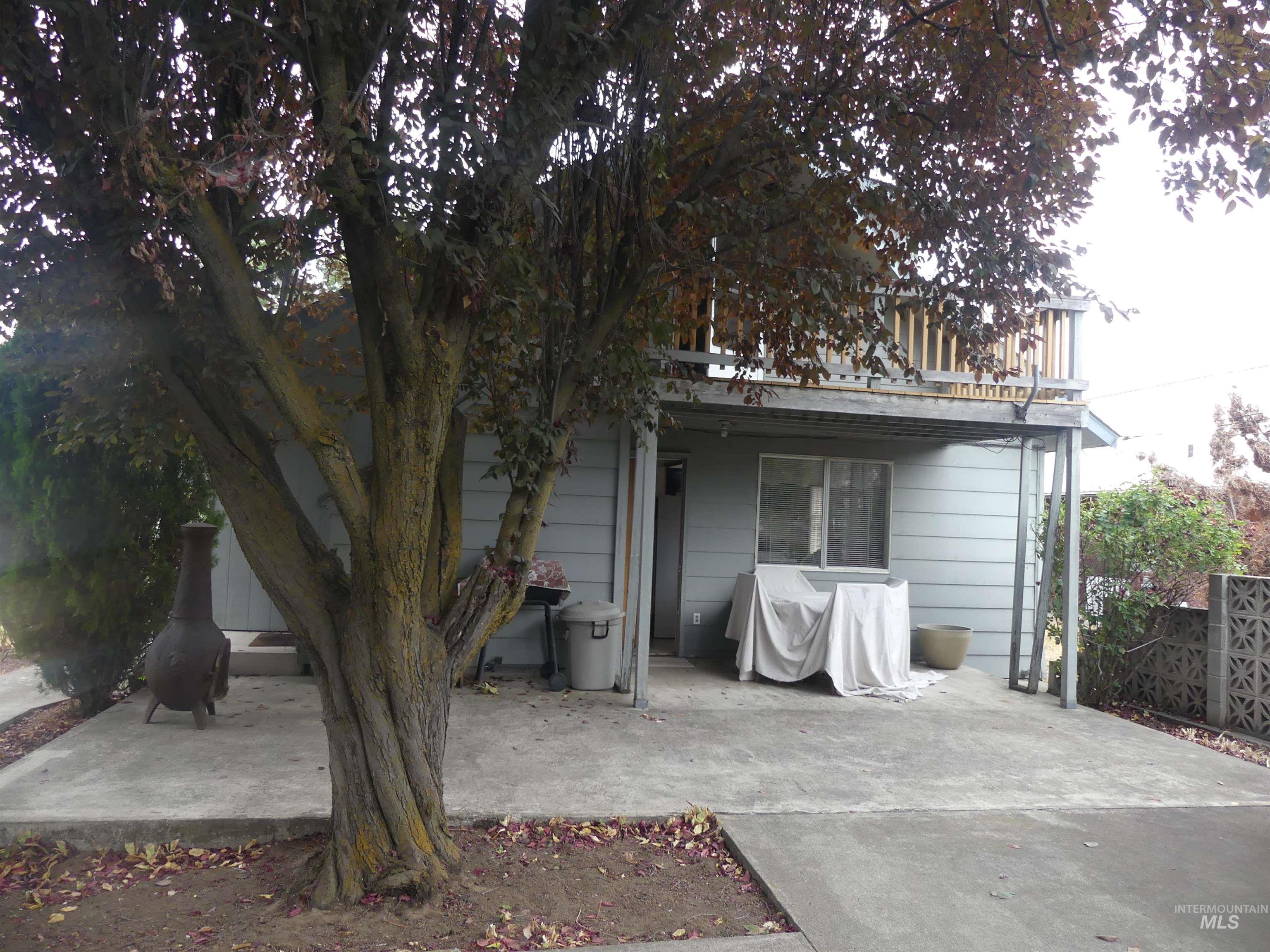 Back of house featuring a patio area and a balcony