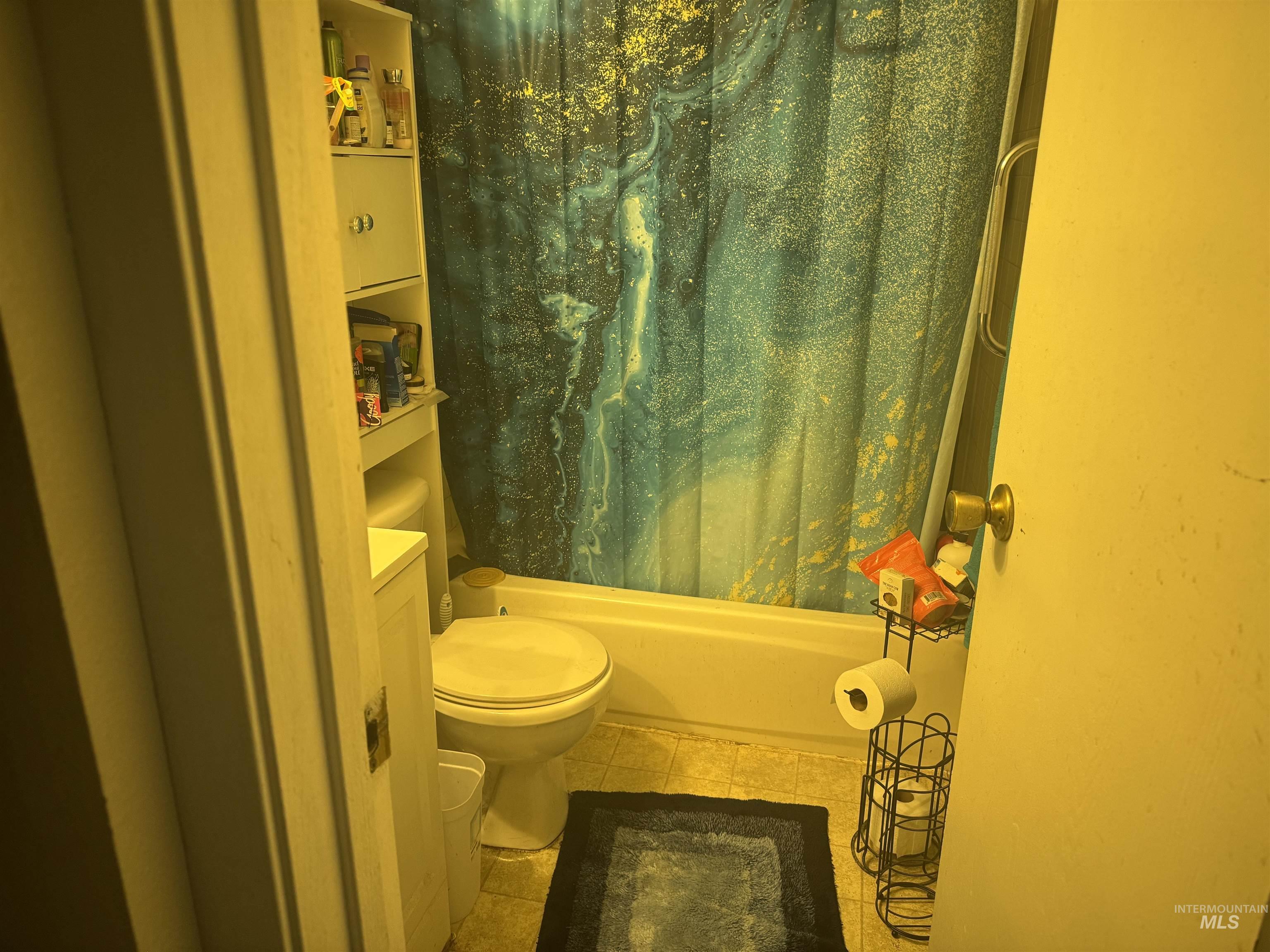Full bathroom with shower / bath combination with curtain and vanity