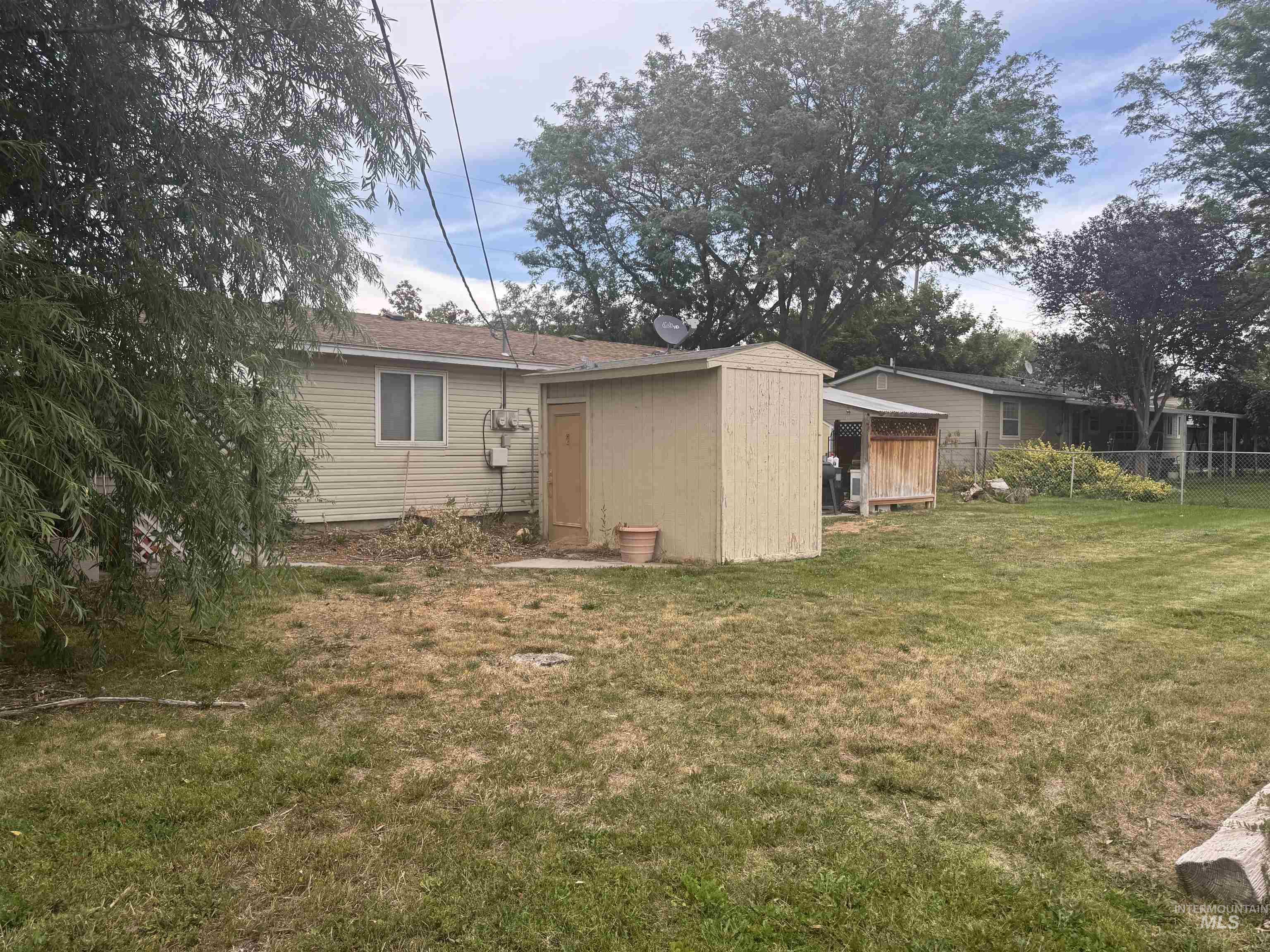 Back of property featuring a shed