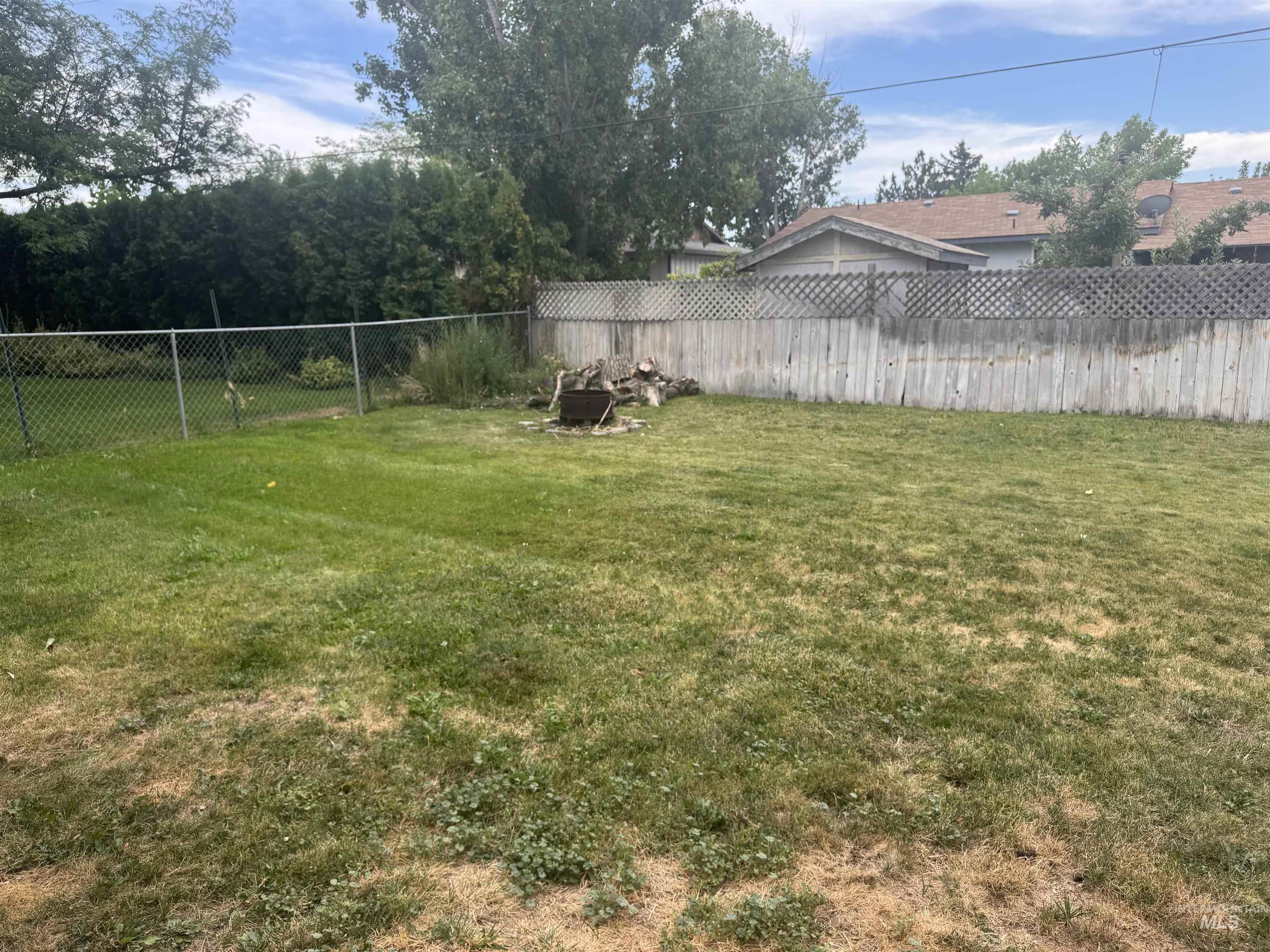 View of fenced backyard