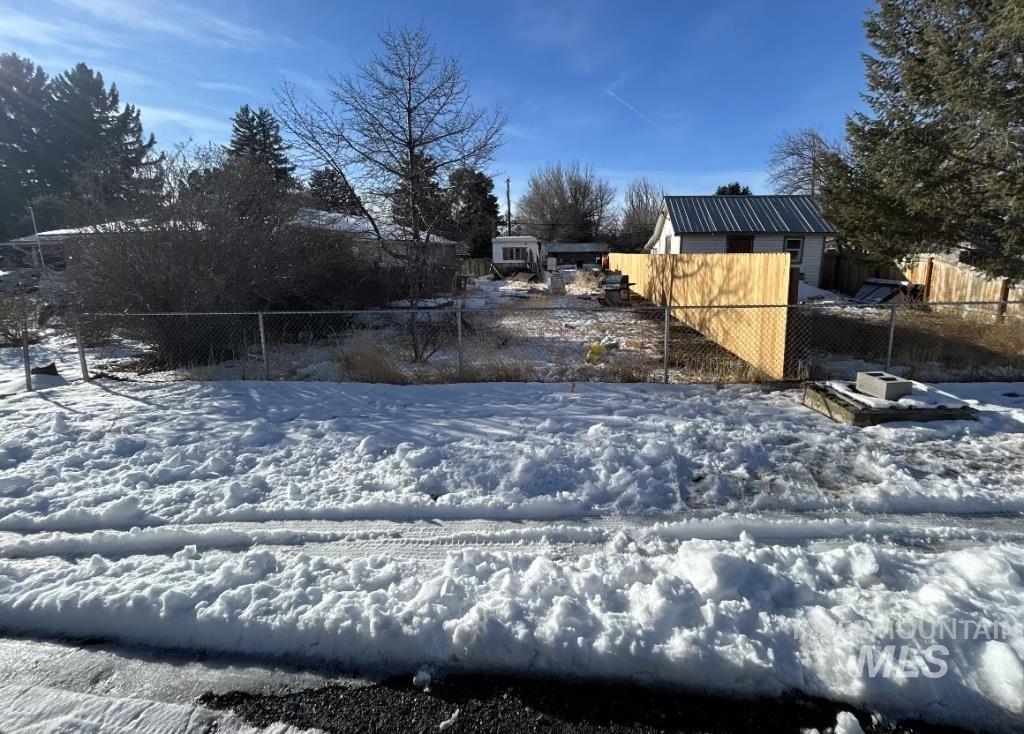 View of yard layered in snow