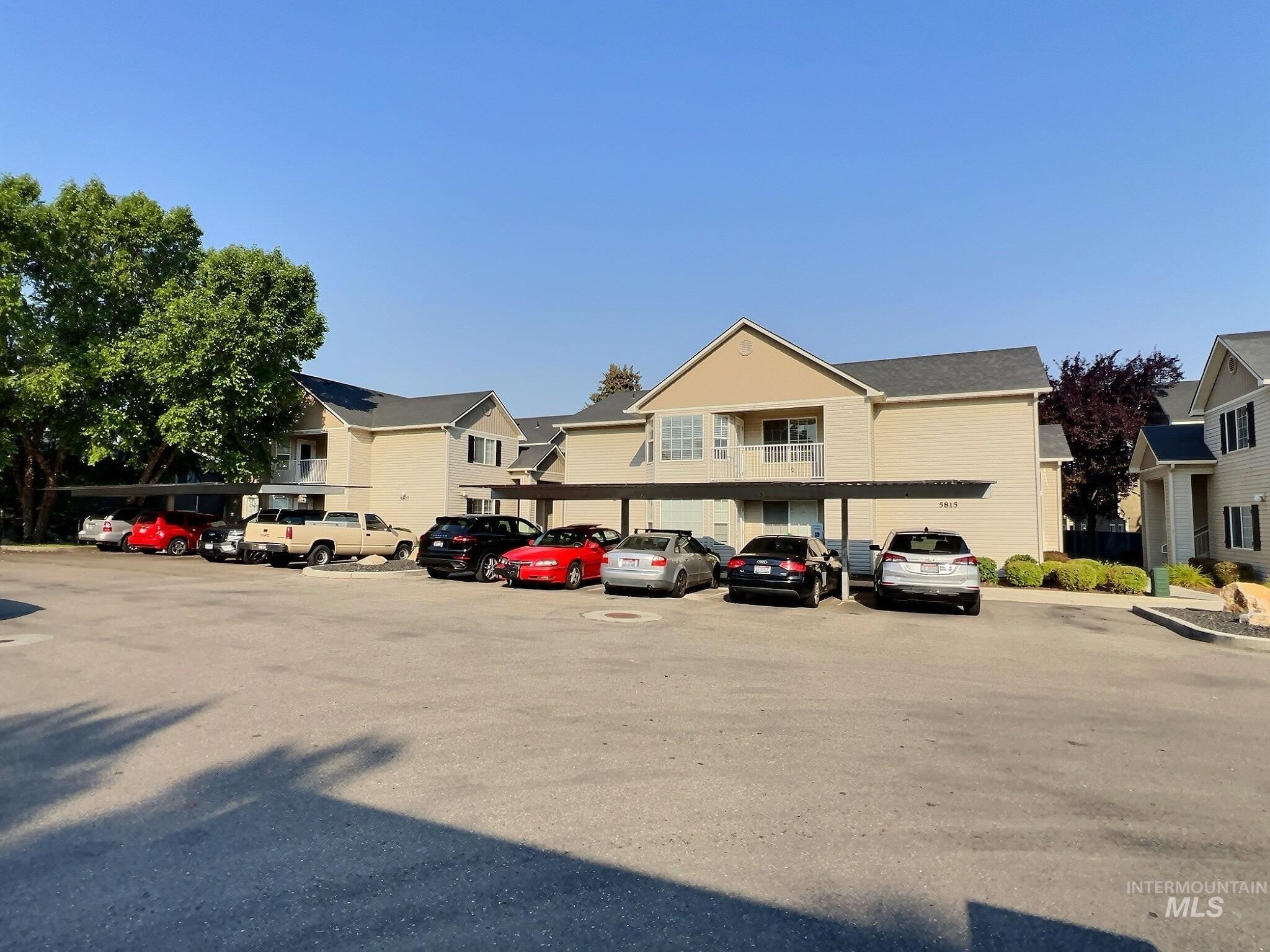 Uncovered parking lot with a residential view