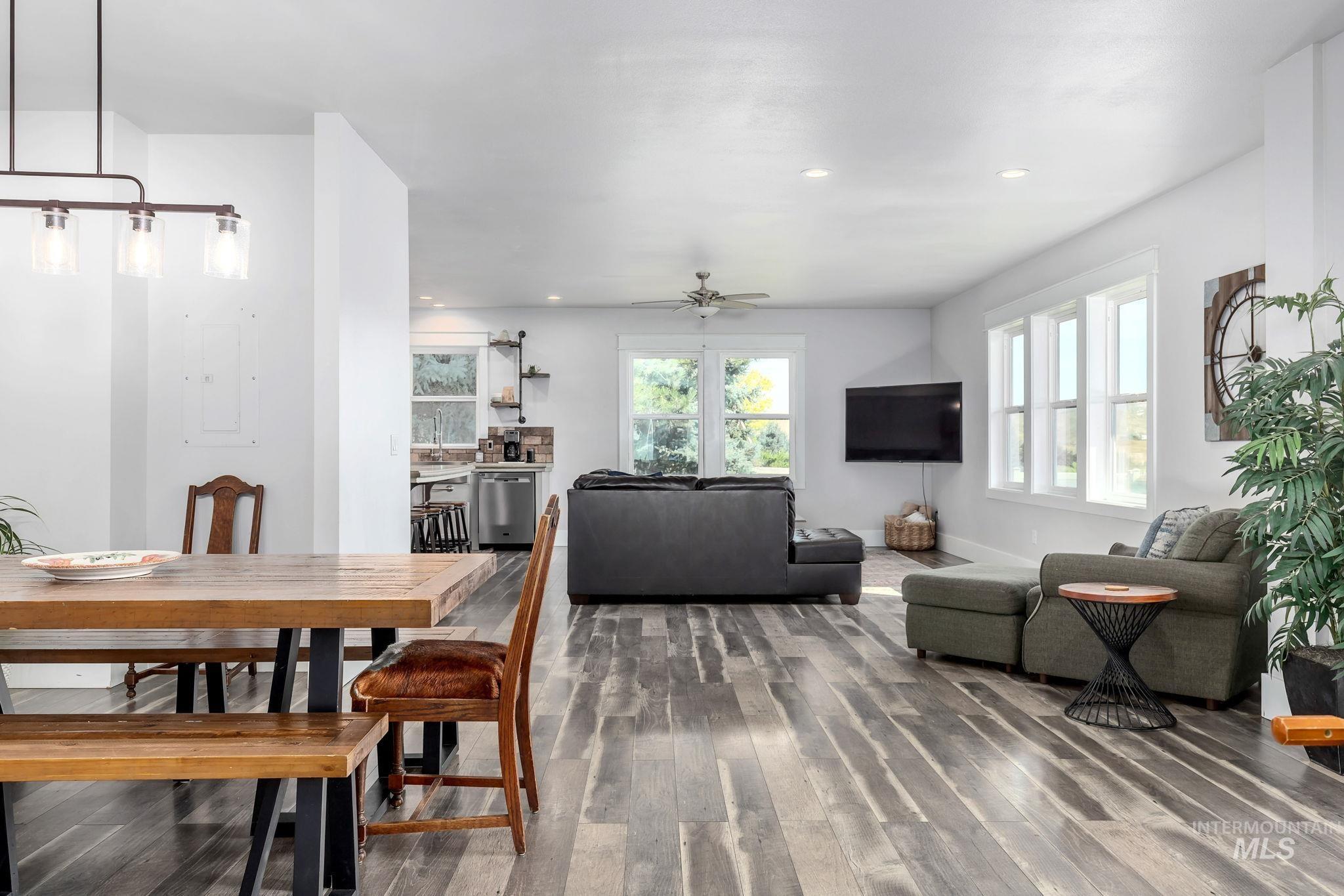 Dining area with wood finished floors, recessed lighting, and a ceiling fan