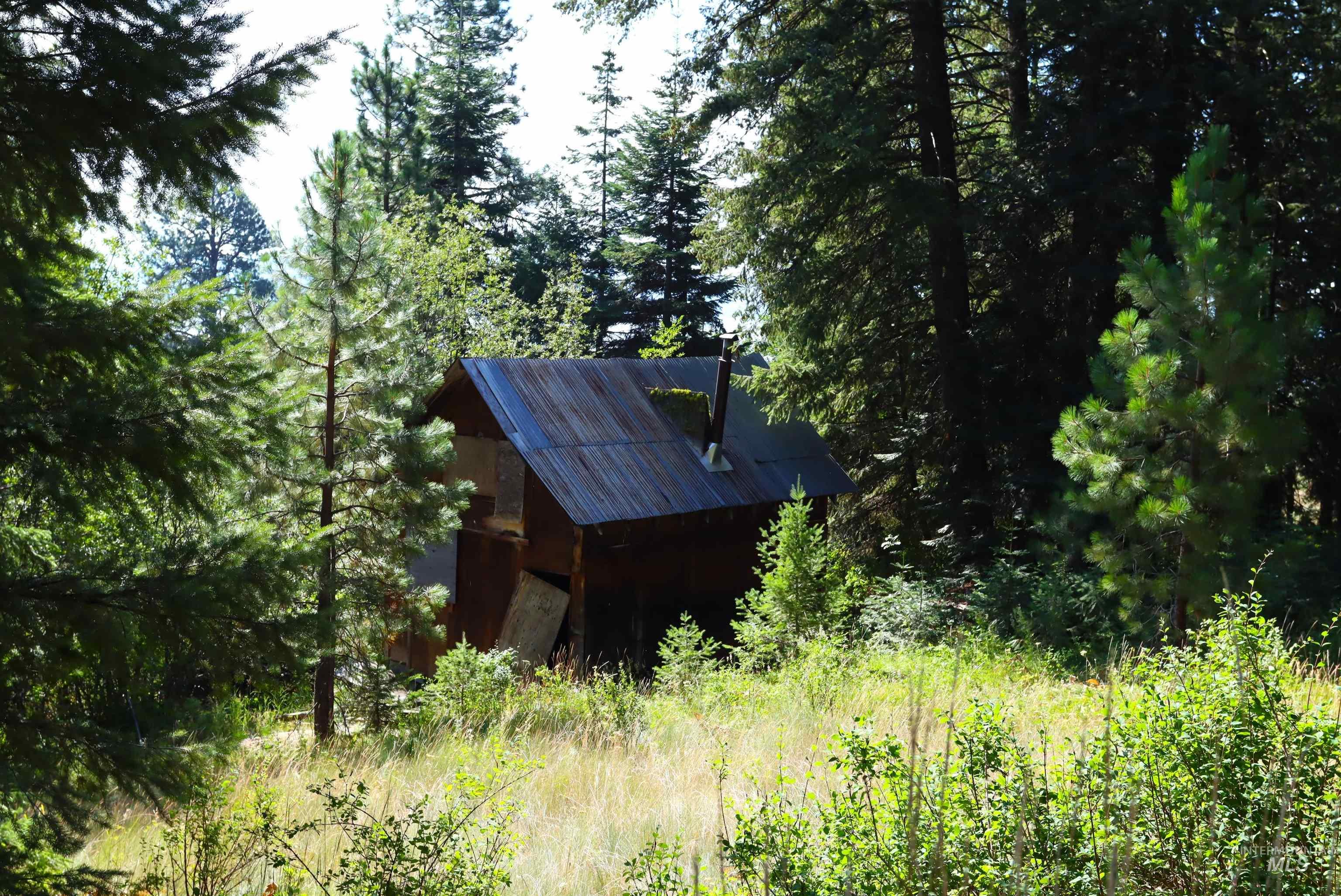 View of outdoor structure featuring a view of trees