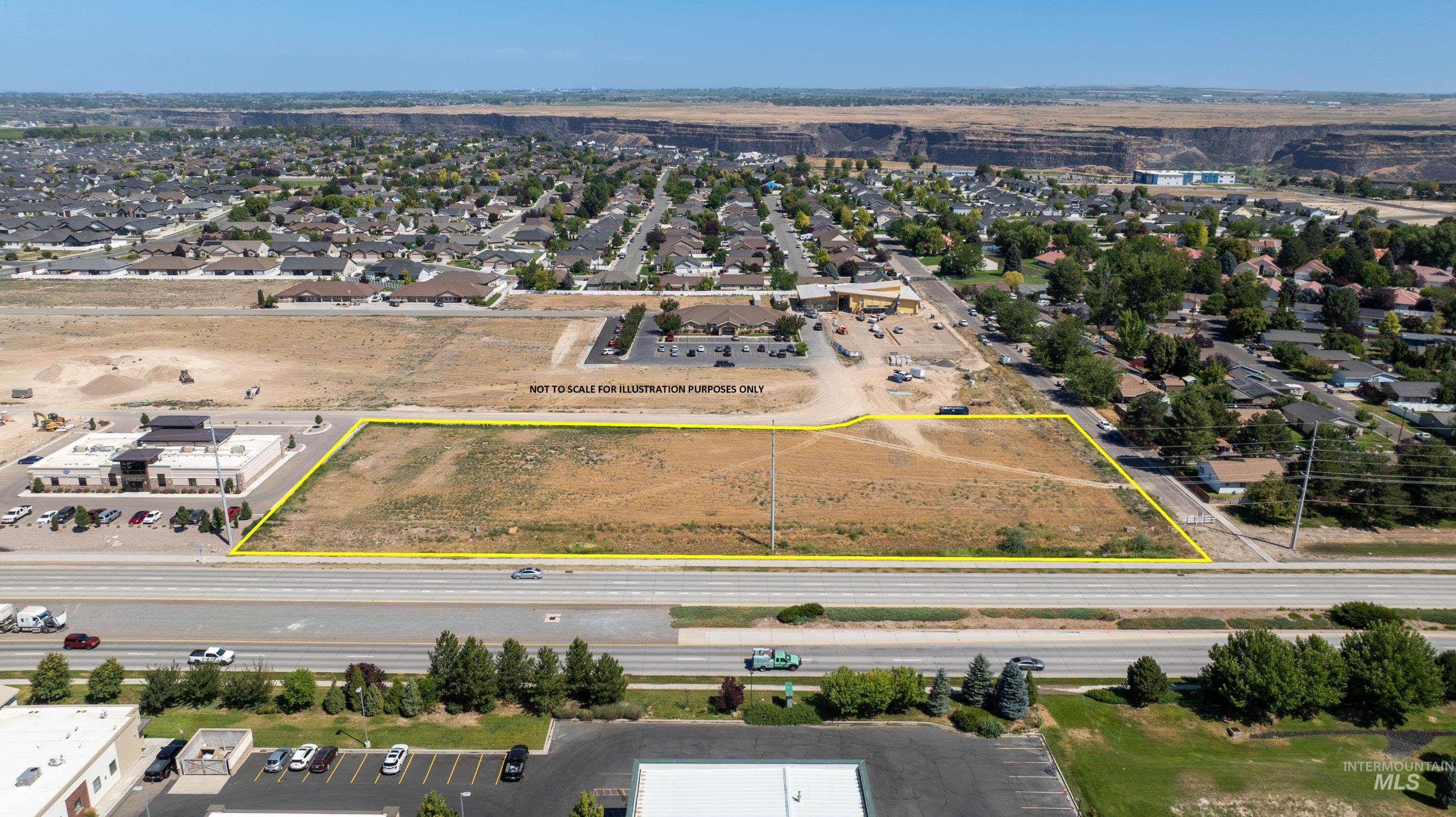 Aerial view of residential area with property boundaries highlighted