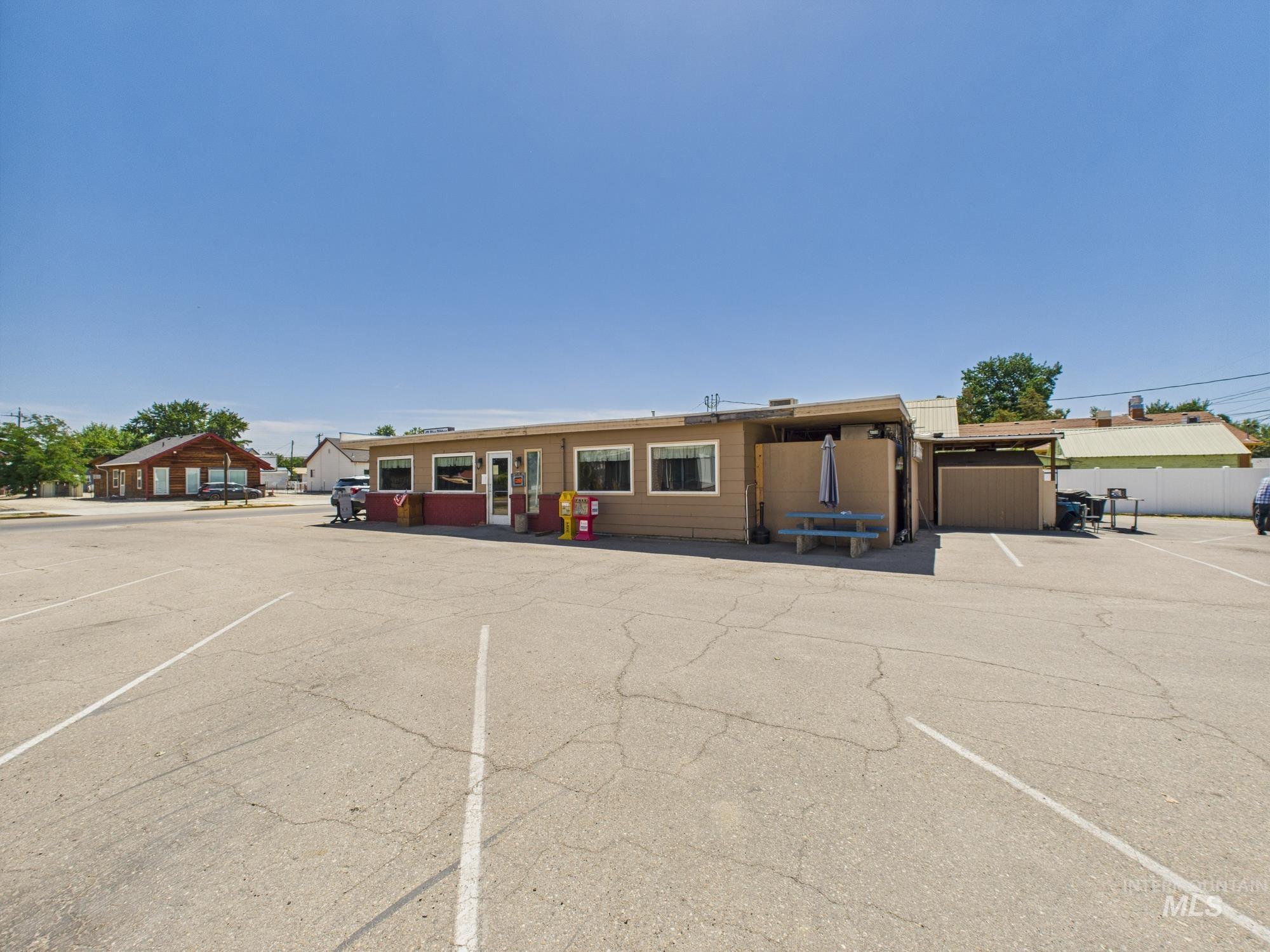 View of front of house with uncovered parking