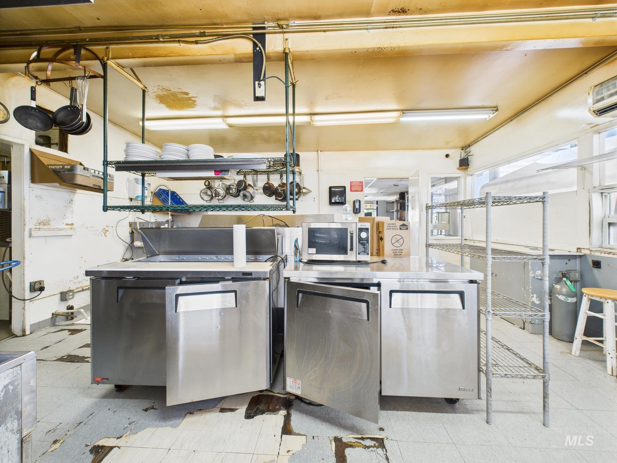 Kitchen featuring stainless steel appliances and washer / clothes dryer