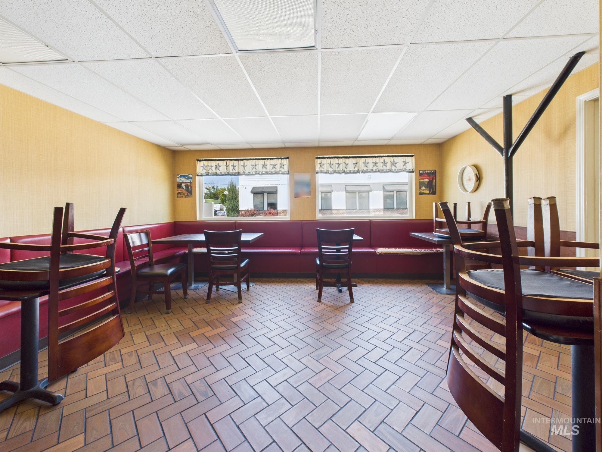 Dining area with a paneled ceiling