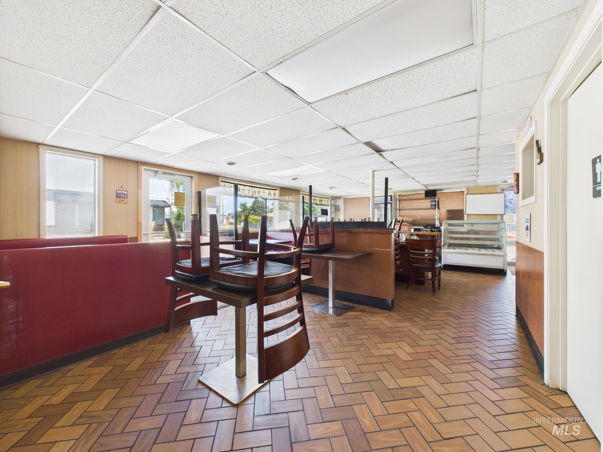 Dining space with a drop ceiling