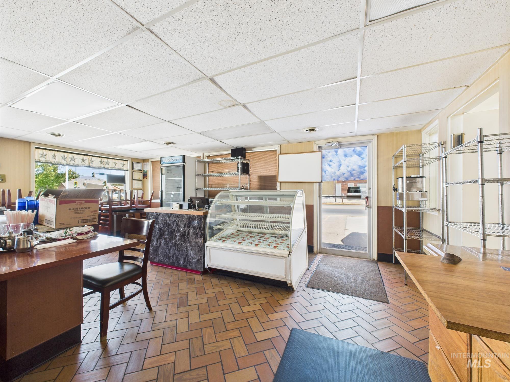Living area featuring a paneled ceiling