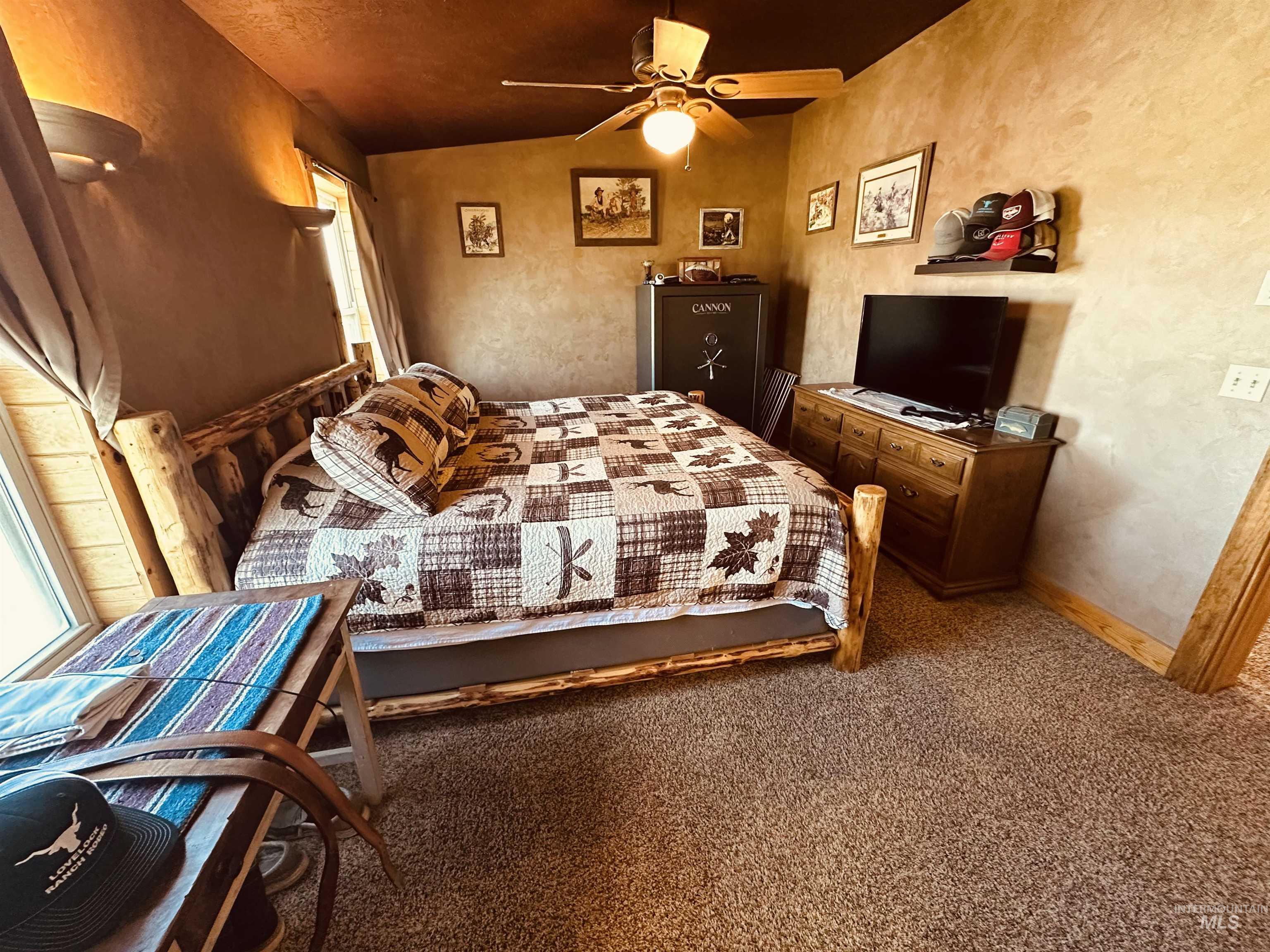 Bedroom with carpet floors and ceiling fan