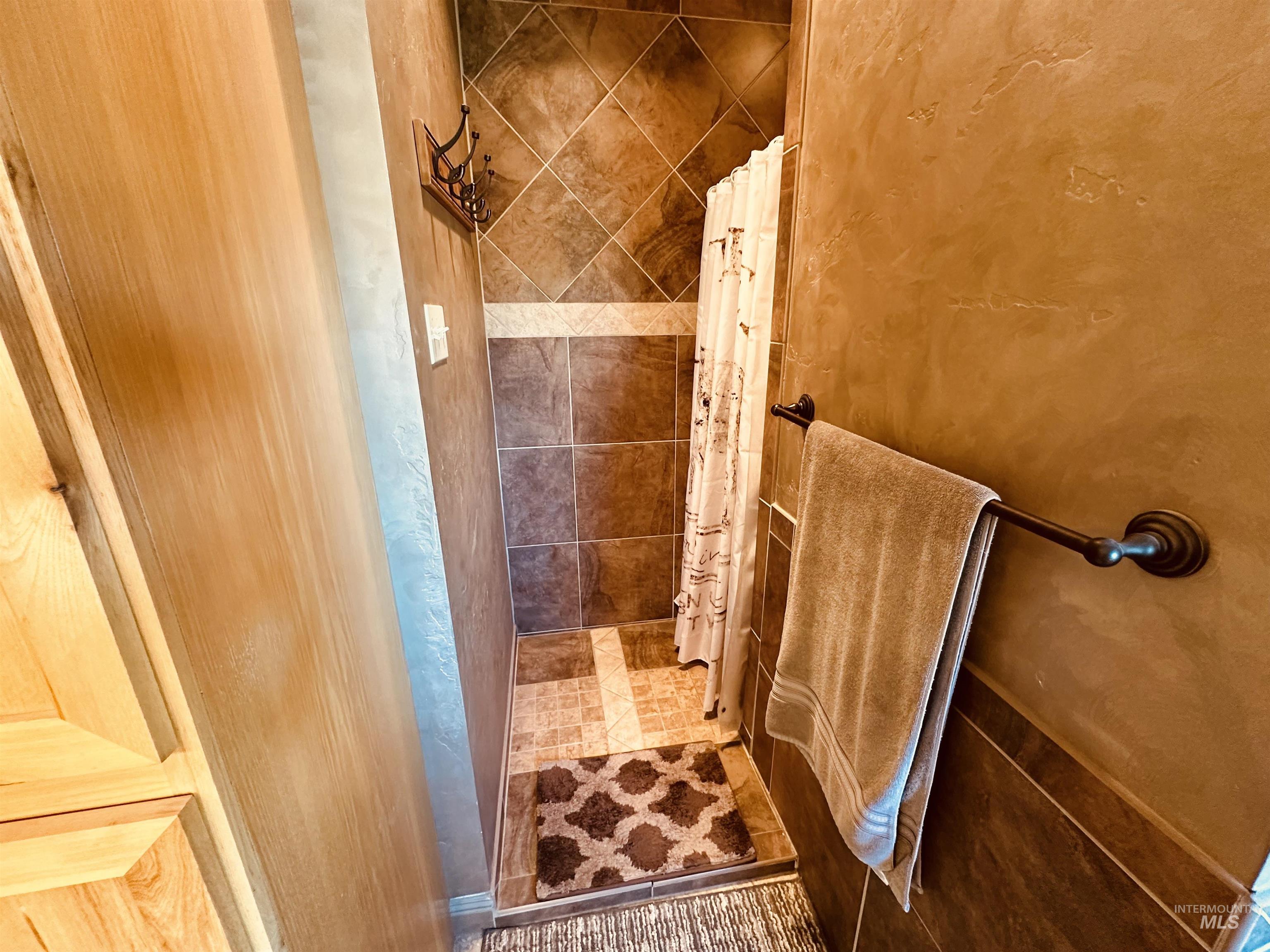 Bathroom with tiled shower