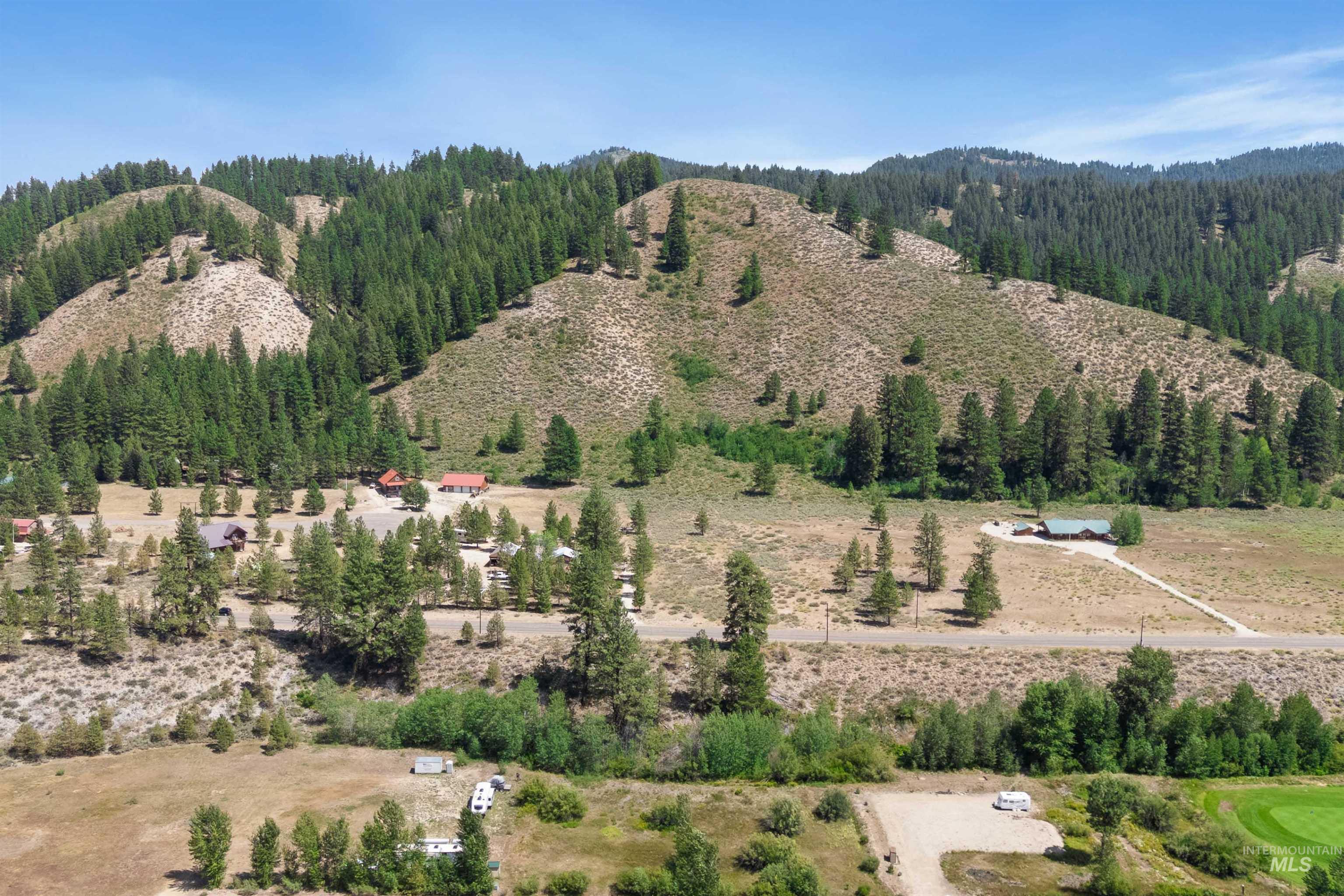 View of mountain background featuring rural landscape