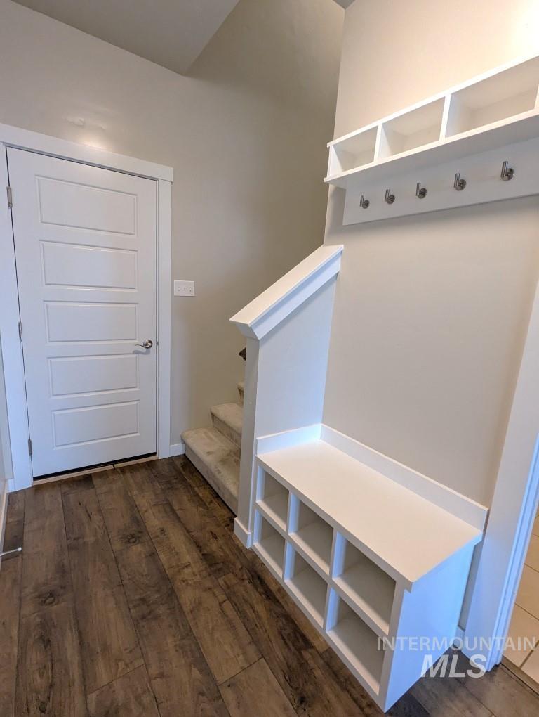 Mudroom with dark wood finished floors