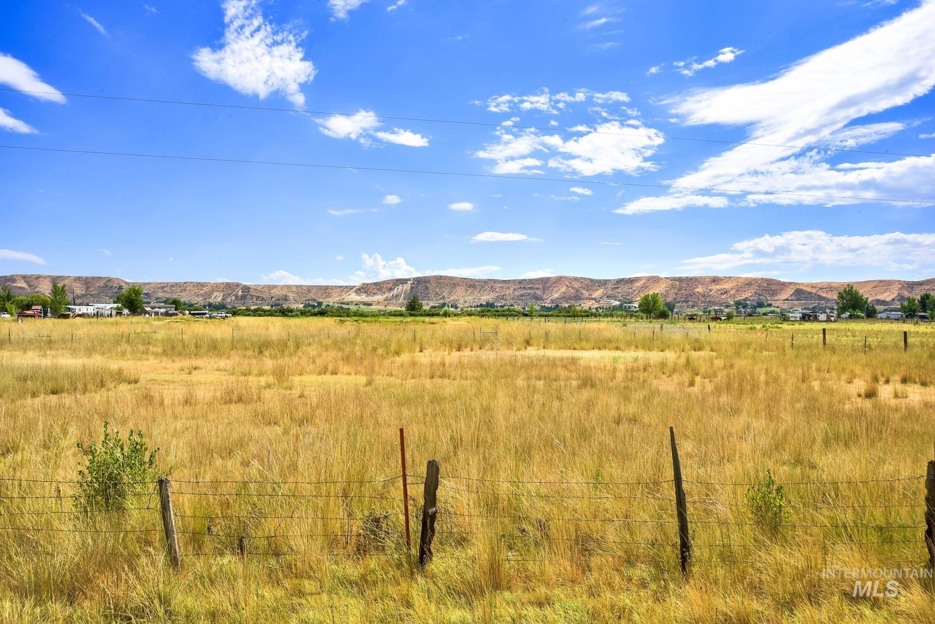 View of mountain background featuring rural landscape