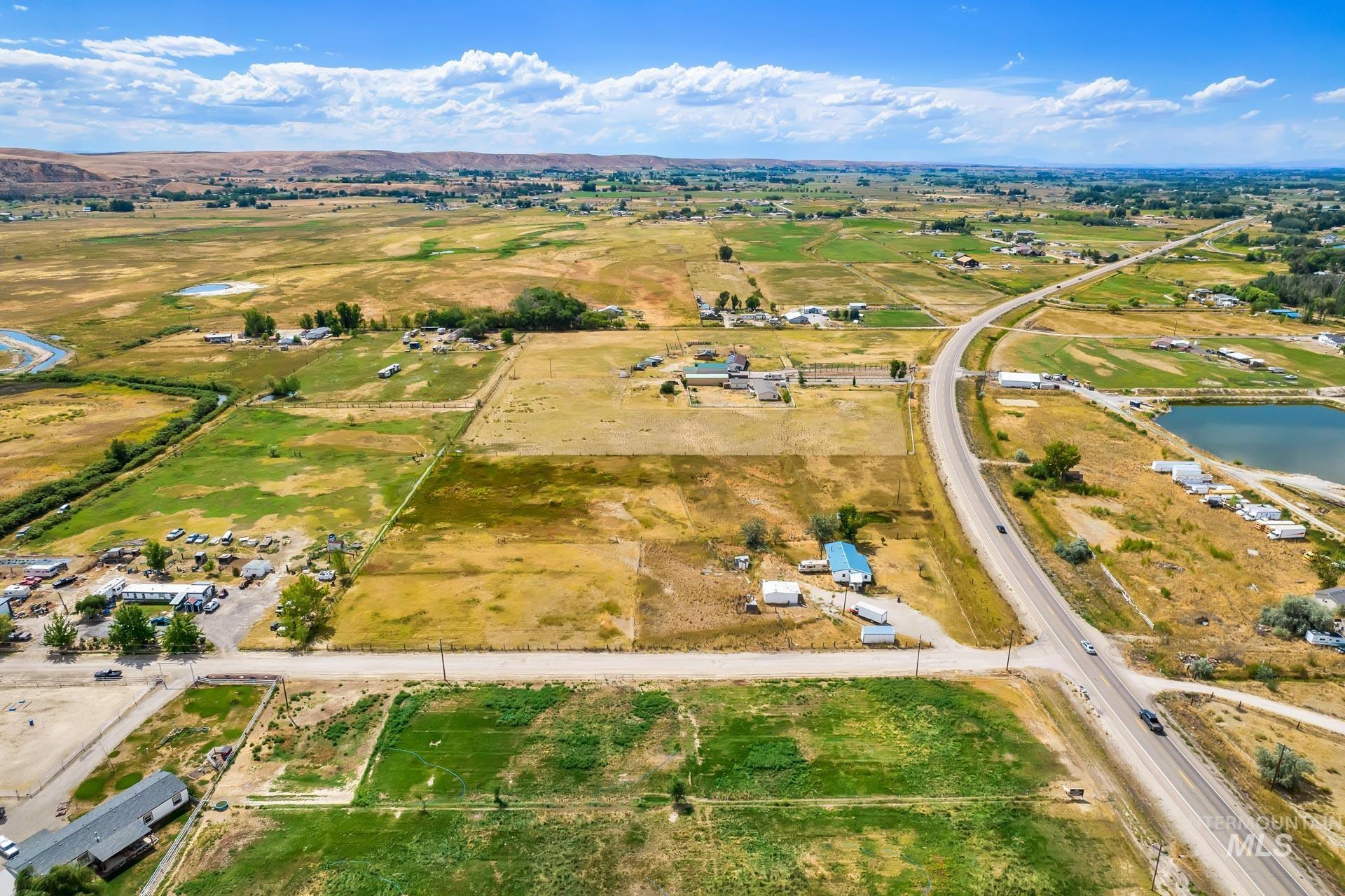 Aerial view of property's location with rural landscape and a nearby body of water